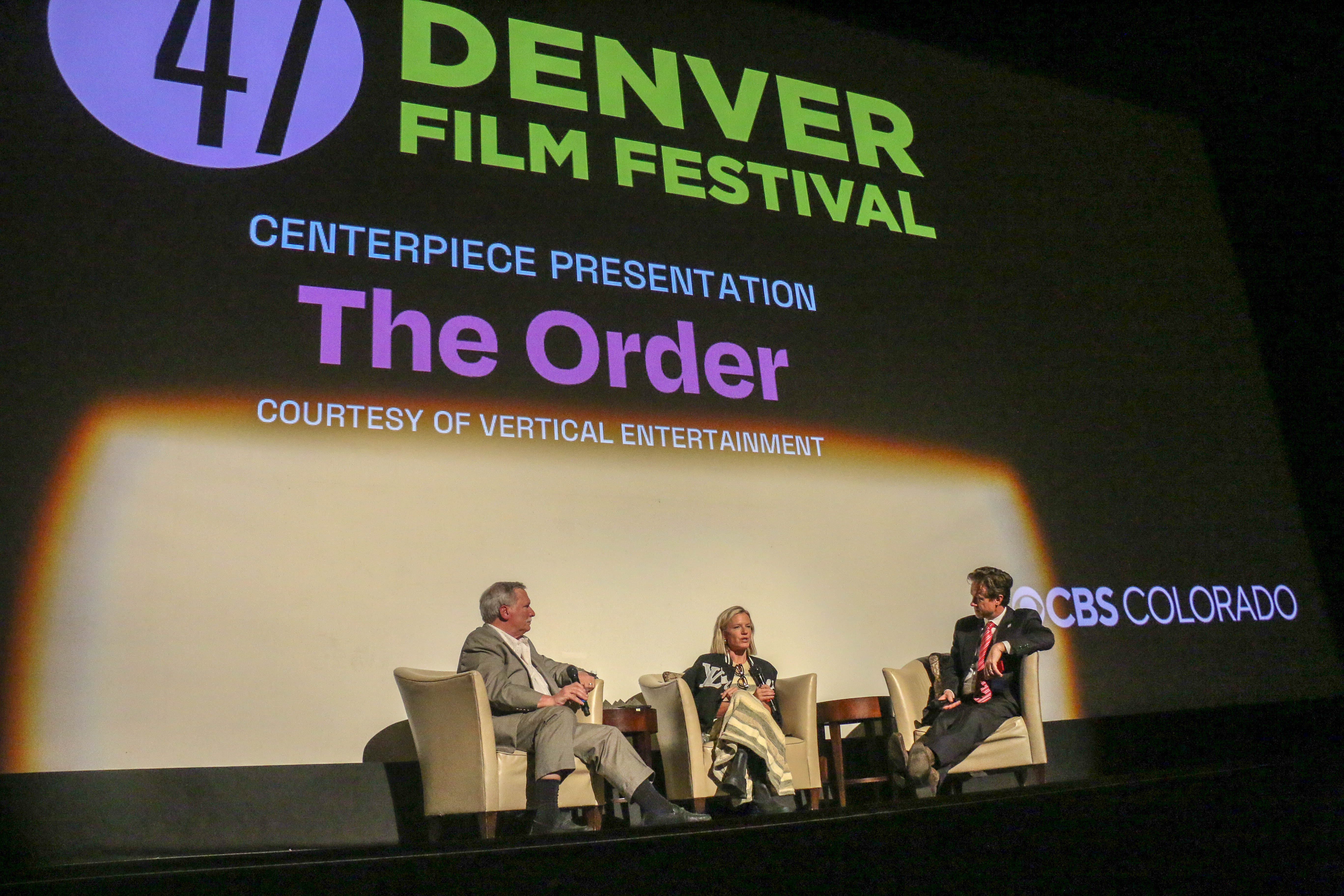 Denver Mayor Mike Johnston, right, moderates a talkback with Kevin Flynn, left, and executive producer Kate Susman after a Denver Film Festival screening of 
