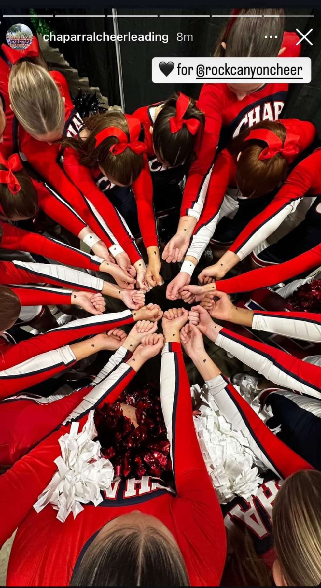 The cheer squad at Douglas County's Rock Canyon High School drew hearts on their hands with magic marker in honor of Ashley Scott. Their new motto is