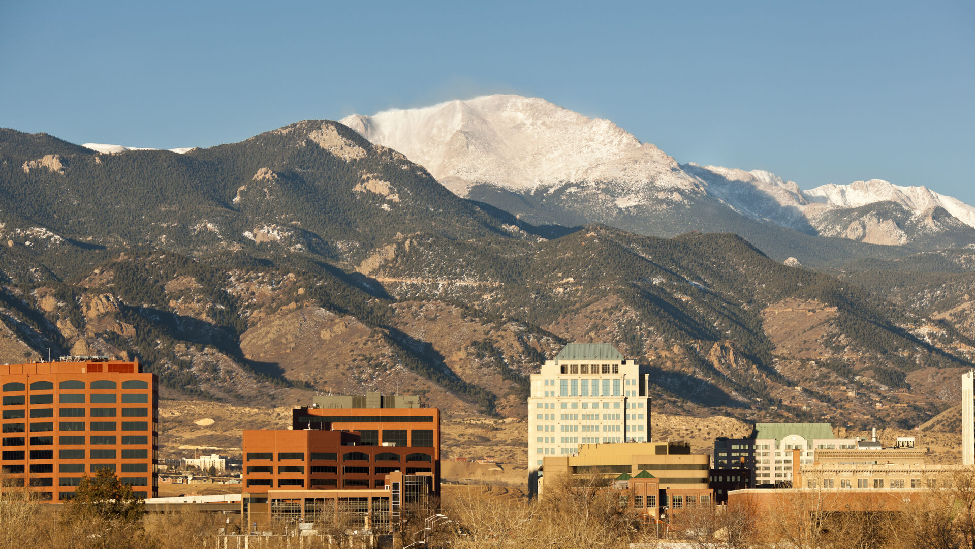 Pikes Peak dominates the skyline over downtown Colorado Springs. (The Gazette file)