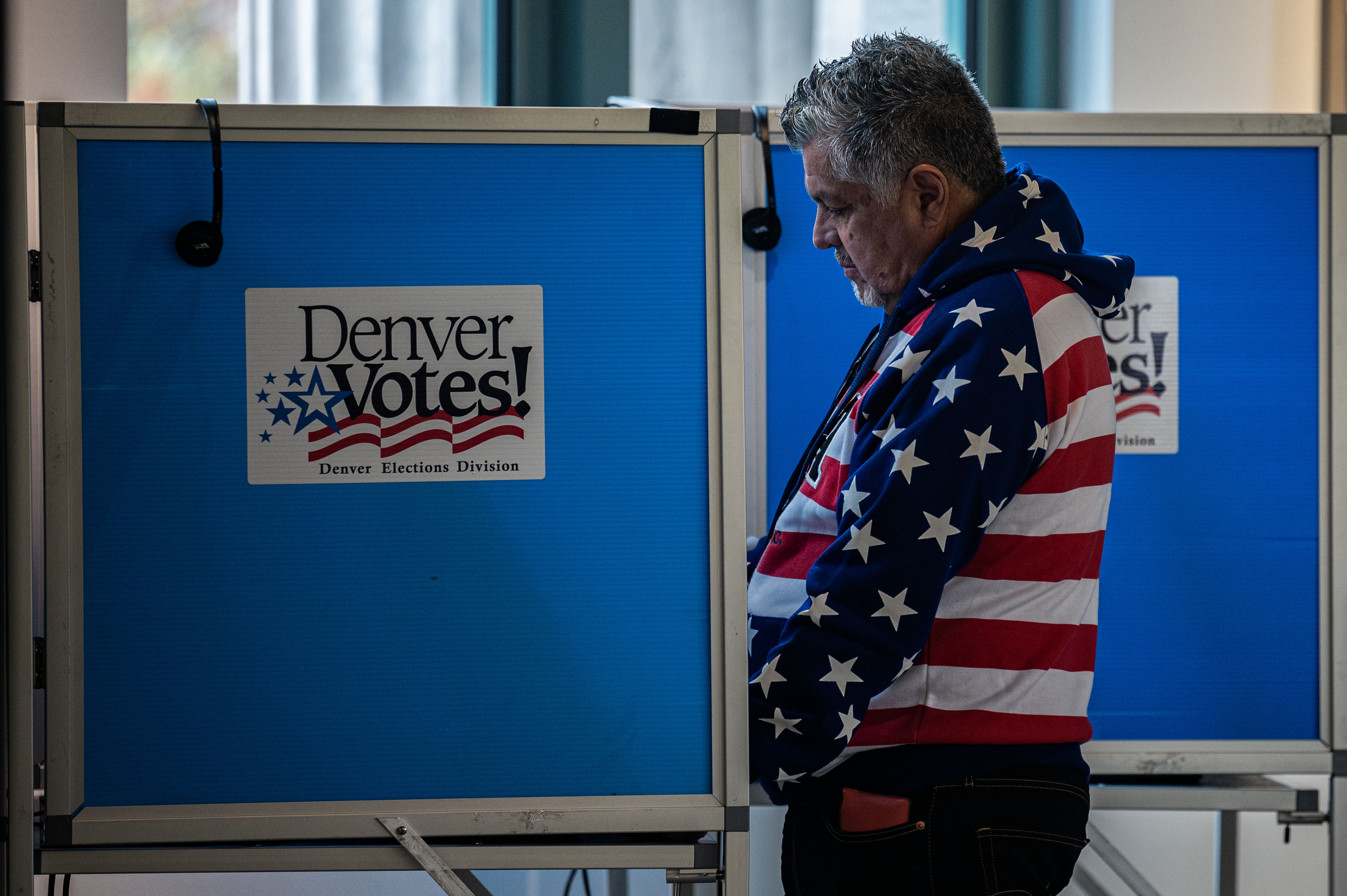 Andy Molina fills out his ballot at a polling center in the McNichols building in Denver on Monday, Nov. 4, 2024. (Stephen Swofford, Denver Gazette) (Stephen Swofford Denver Gazette)