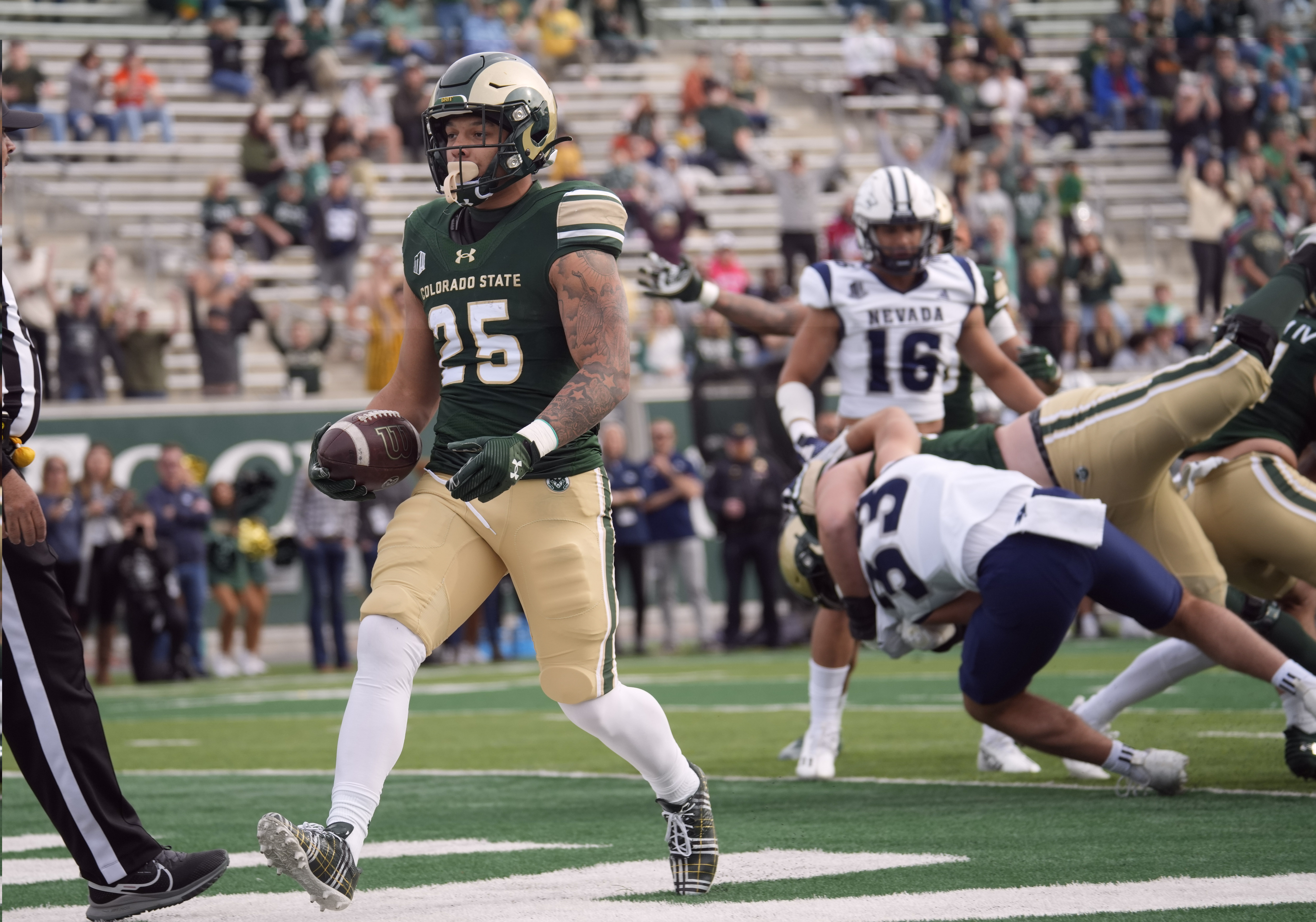 Colorado State running back Avery Morrow runs in for a touchdown in the first half of an NCAA college football game against Nevada on Saturday, Nov. 18, 2023, in Fort Collins, Colo. (AP Photo/David Zalubowski) (David Zalubowski)