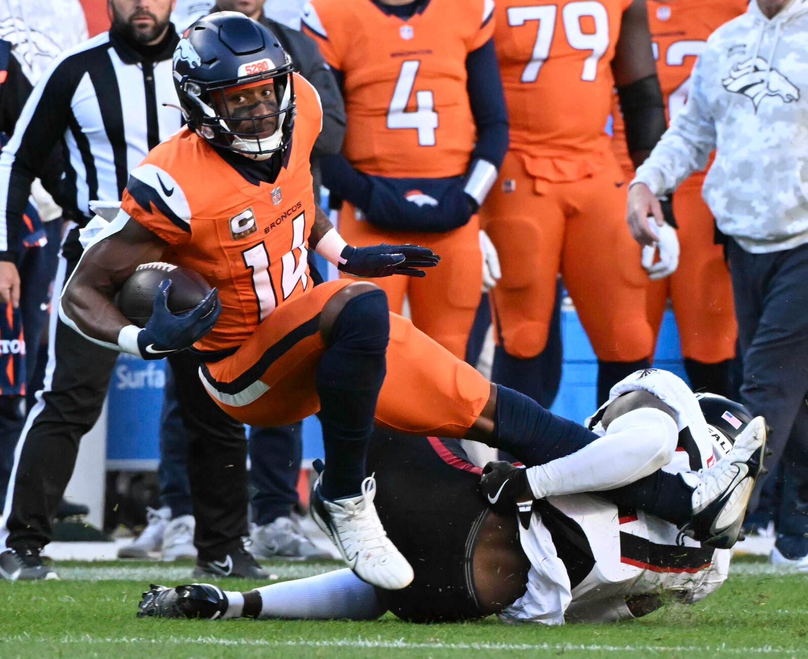 Denver Broncos wide receiver Courtland Sutton (14) leans forward to get a few more yards during the second quarter of a game at Empower Field at Mile High on Sunday, Nov. 17, 2024. The Broncos defeated the Falcons 38-6. (Jerilee Bennett,The Gazette)