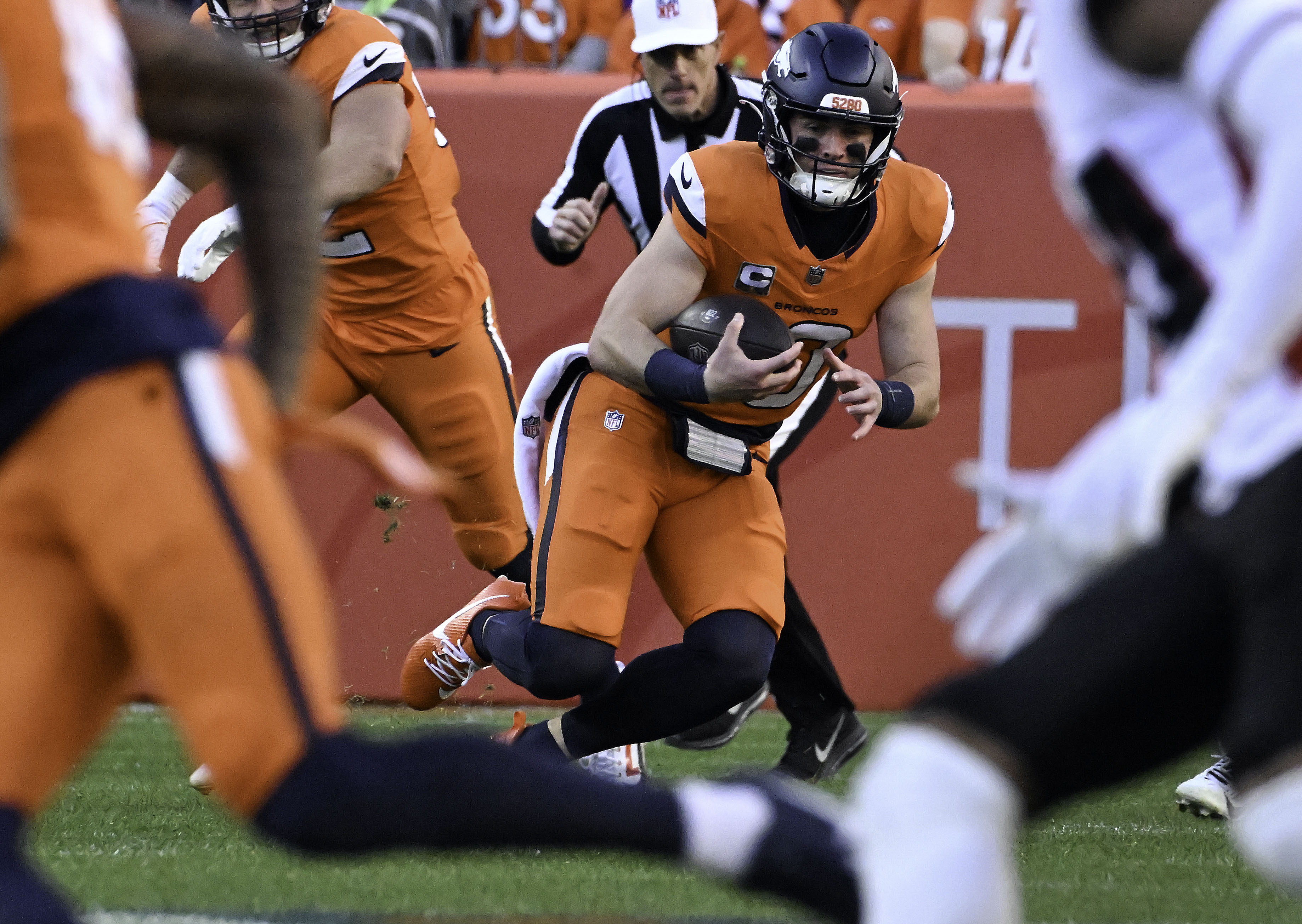 Denver Broncos quarterback Bo Nix (10) runs with the ball during a game against the Falcons at Empower Field at Mile High on Sunday, Nov. 17, 2024. (Jerilee Bennett,The Gazette)