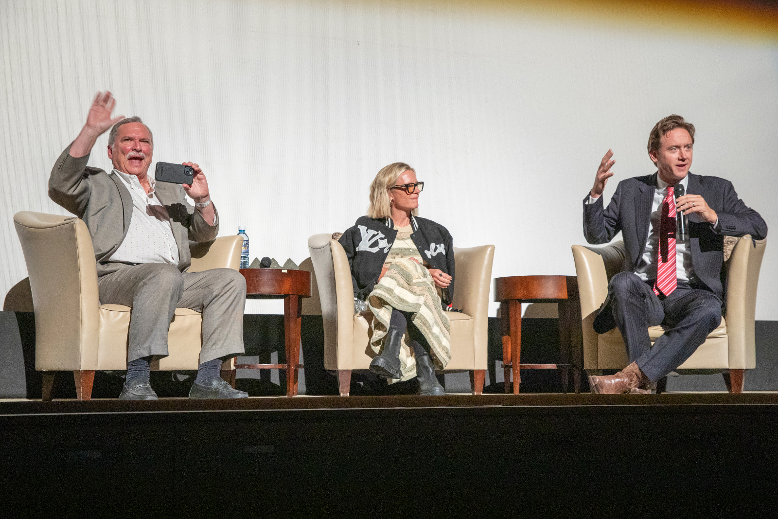 Denver Mayor Mike Johnston, right, moderates a talkback with Kevin Flynn, left, and executive producer Kate Susman after a Denver Film Festival screening of 