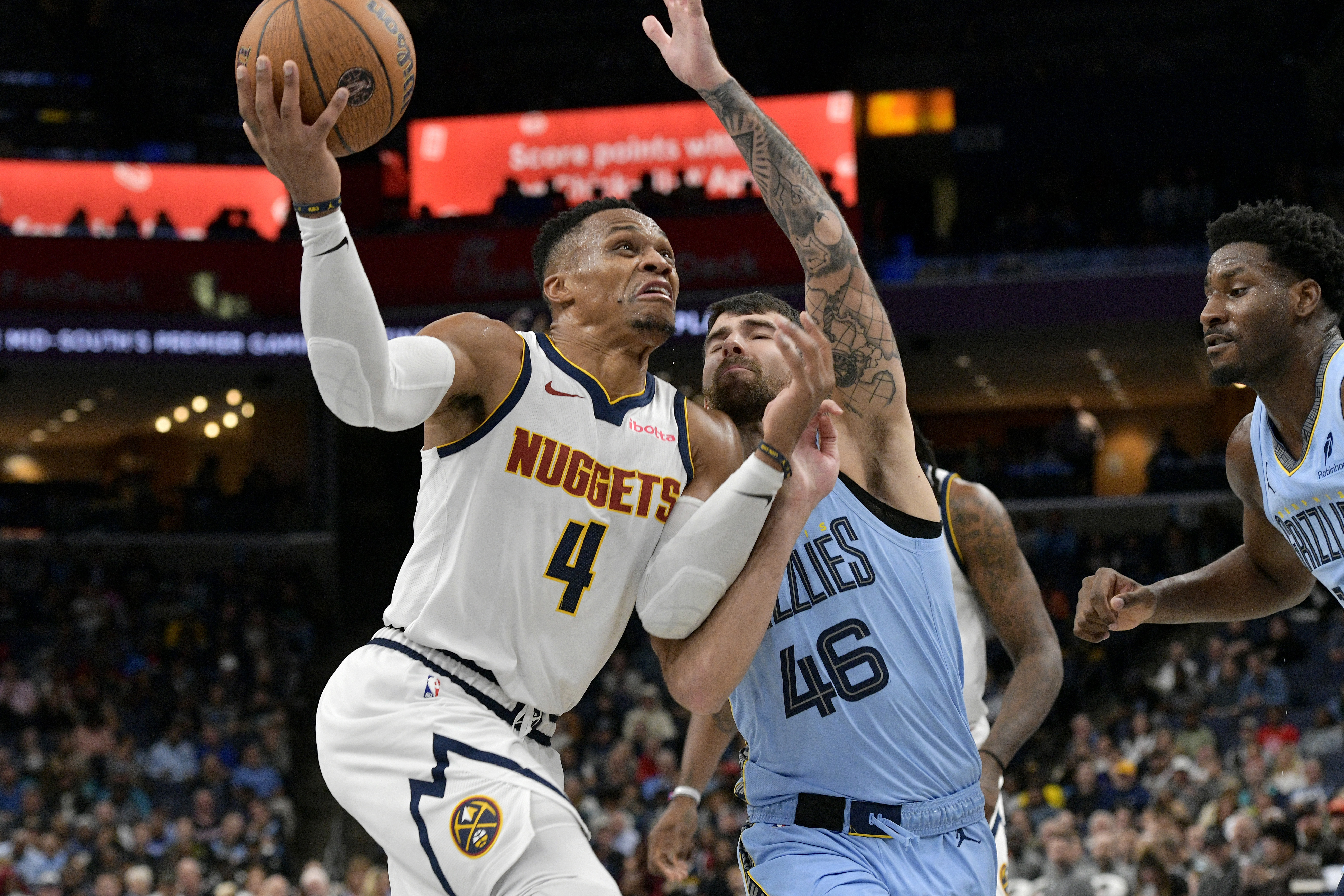 Denver Nuggets guard Russell Westbrook (4) drives against Memphis Grizzlies guard John Konchar (46) in the second half of an NBA Cup basketball game on Tuesday in Memphis, Tenn. (The Associated Press)