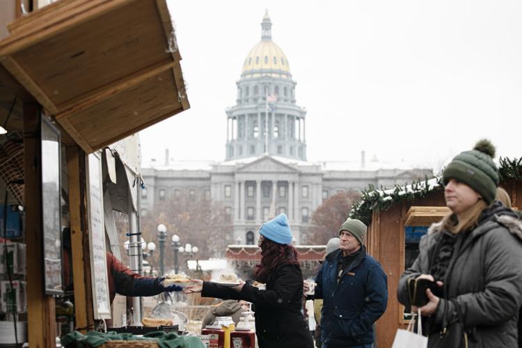 Shoppers bought hot chocolates and warm food to stay warm at Denver Christkindlmarkt (copy) (copy)
