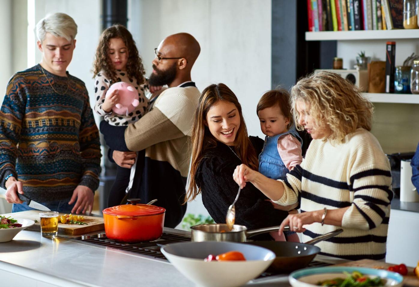 Multigenerational family cooking together resized image