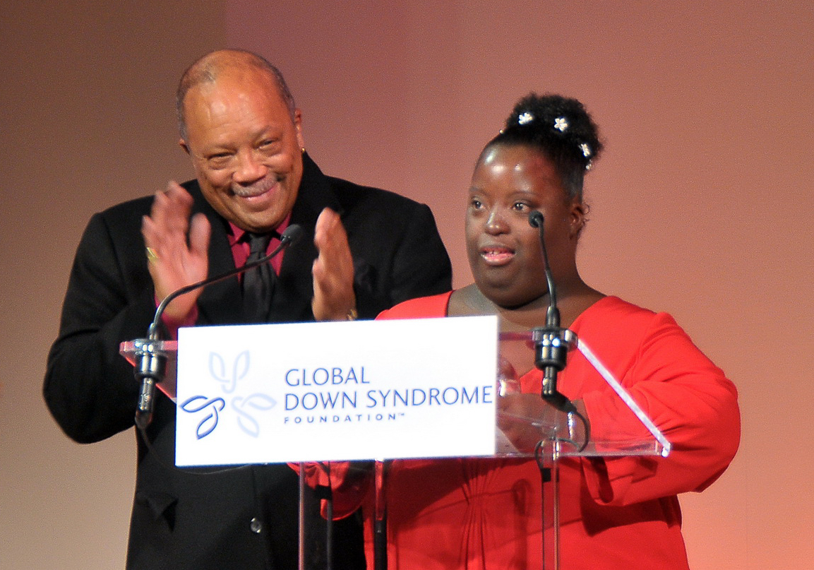 Quincy Jones congratulates DeOndra Dixon on stage in Denver at the 2009 Be Beautiful Be Yourself Fashion Show as she receives the Quincy Jones Exceptional Advocacy Award. (GLOBAL DOWN SYNDROME FOUNDATION)