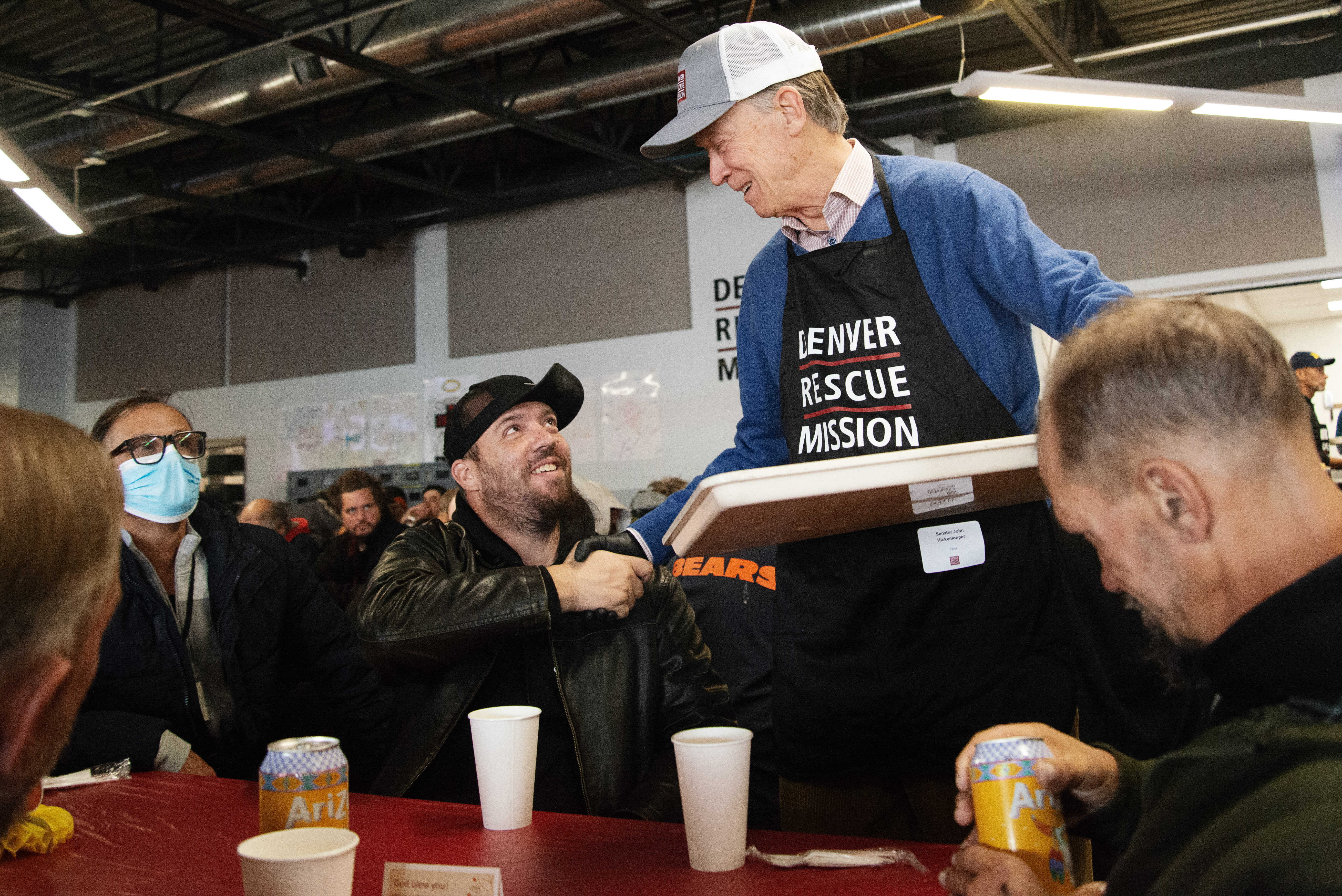 Sen. John Hickenlooper shakes the hand of Anthony Crescente, who recognized and thanked him for volunteering, alongside dozens of other Denver Rescue Mission staff and volunteers serve 537 Thanksgiving meals to Denver's needy population the day before Thanksgiving on Wednesday, Nov. 27, 2024 at the group's Lawrence St. location. “It inspires me. I worked hard my whole life, but I got a lot of breaks. Some of these folks don’t get a lot of breaks. It inspires me to do more… Everybody in here is somebody’s son, brother, daughter,” Sen. Hickenlooper told the Denver Gazette. (TomHellauerMultimedia Producertom.hellauer@denvergazette.comhttps://denvergazette.com/content/tncms/avatars/f/9e/622/f9e6228a-3b6b-11ed-bf10-fbb71fa8e421.f54b911252c540f1d61709edc4727a39.png)