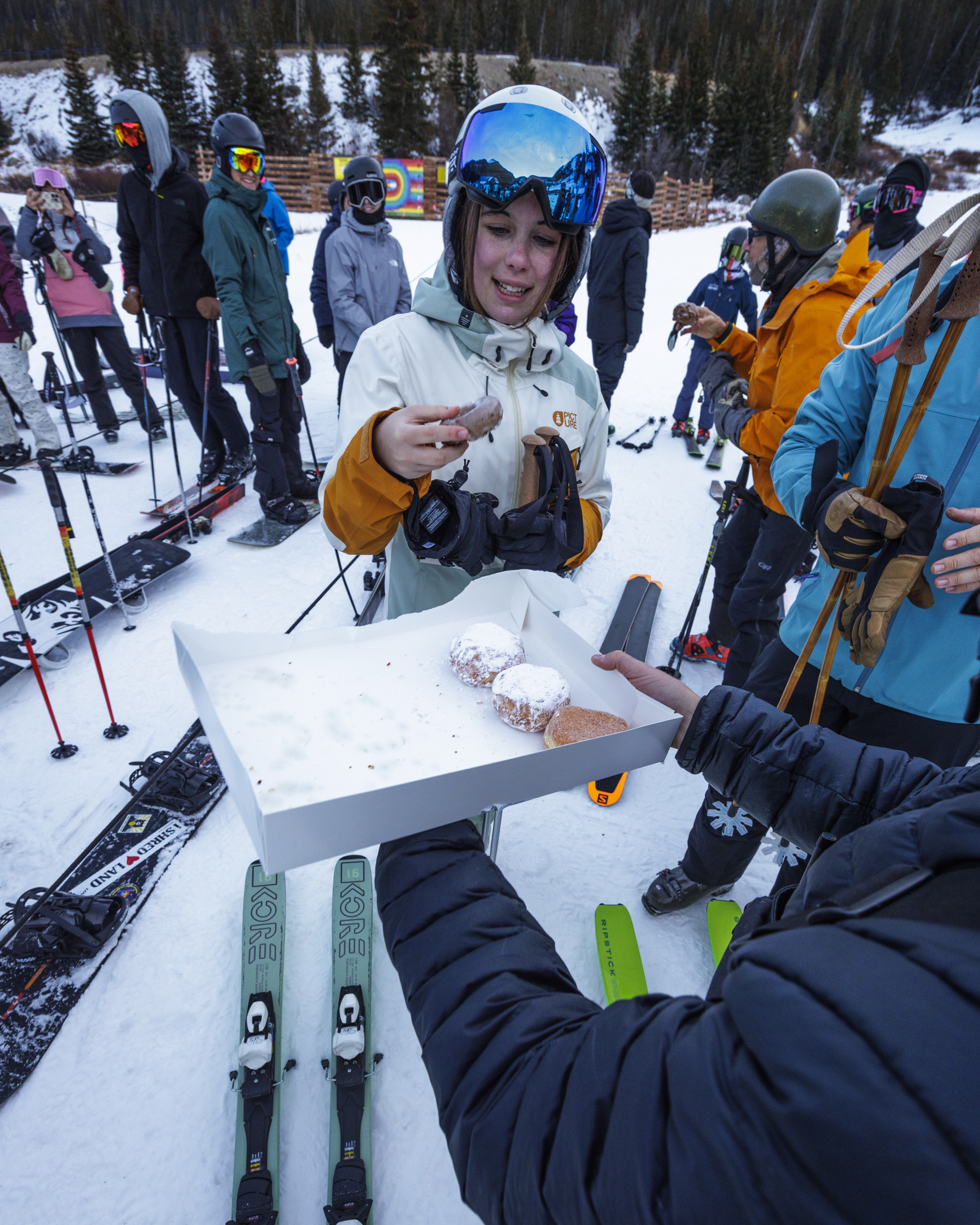 A female skier picks a donut on opening day Saturday, Nov. 2, 2024 at Arapahoe Basin Ski Area in Dillon, Colorado. (Lucas Herbert, Arapahoe Basin Ski Area)