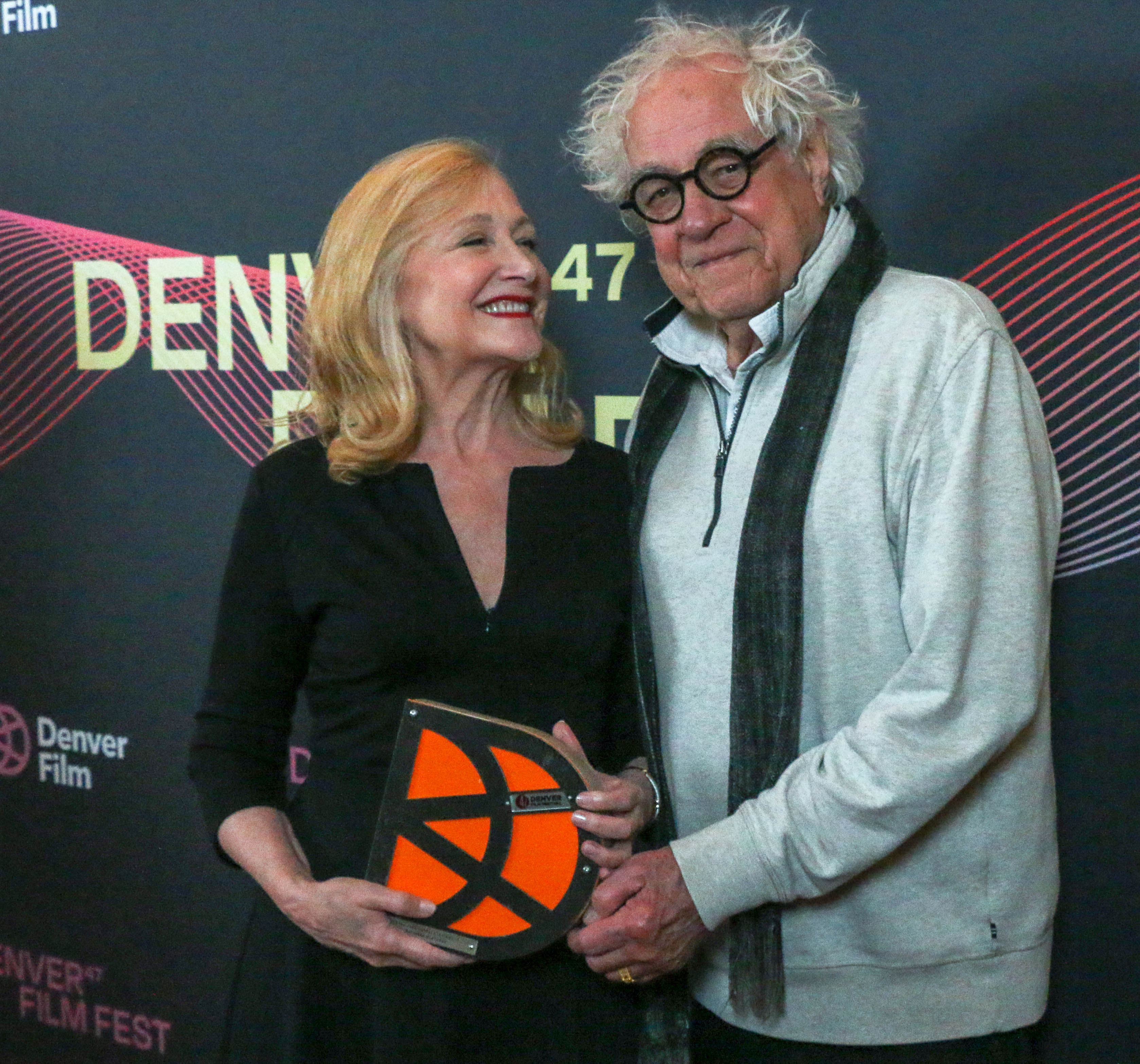 Patricia Clarkson accepts Denver Film's John Cassavetes Award for trailblazing film artists from festival founder Ron Henderson on Nov. 2, 2024, at the MCA Denver's Holiday Theater. (JOHN MOORE/DENVER GAZETTE)