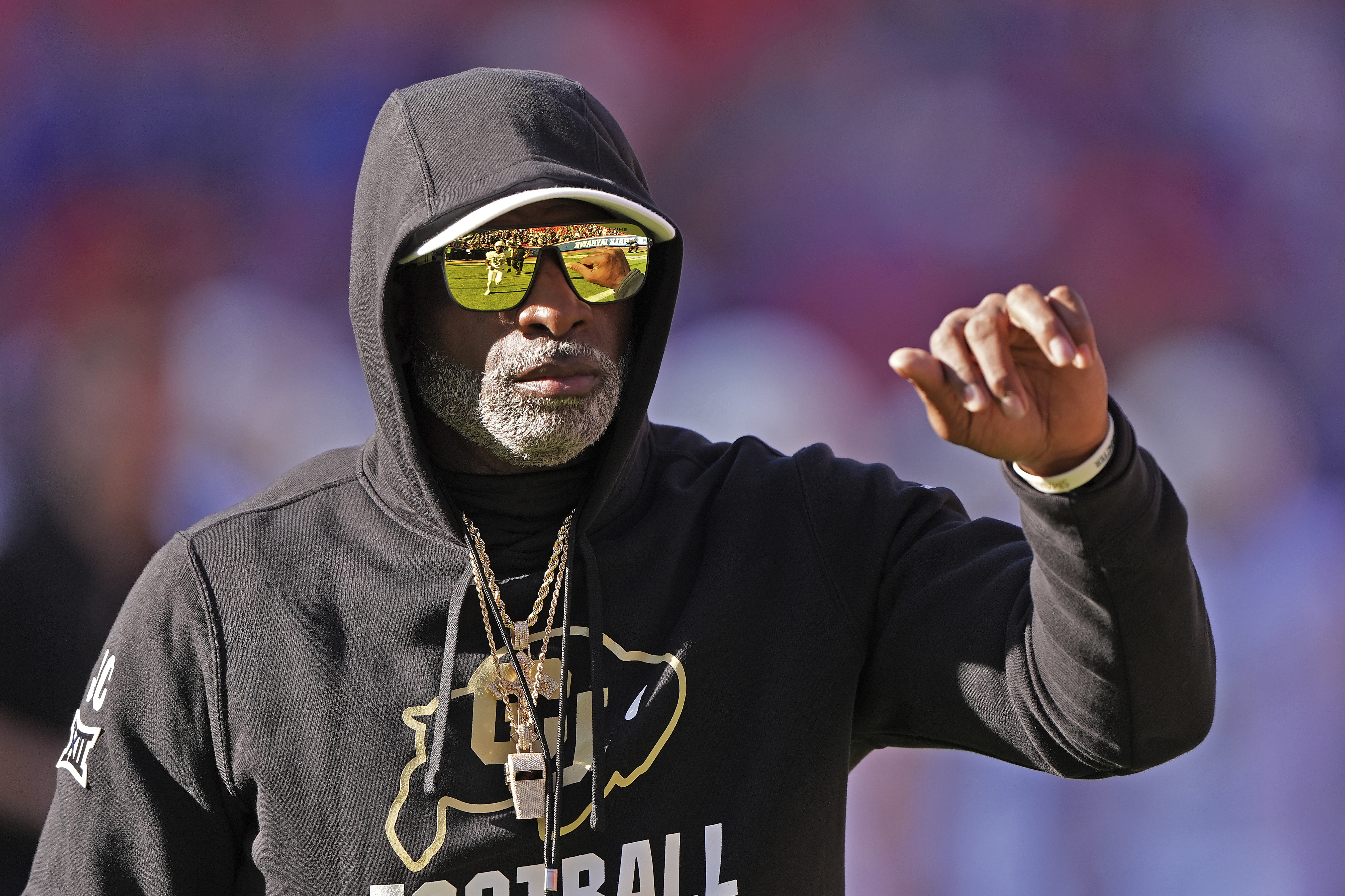 Colorado head coach Deion Sanders watches warmups before an NCAA college football game against Kansas Saturday, Nov. 23, 2024, in Kansas City, Mo. (AP Photo/Charlie Riedel) (Charlie Riedel)