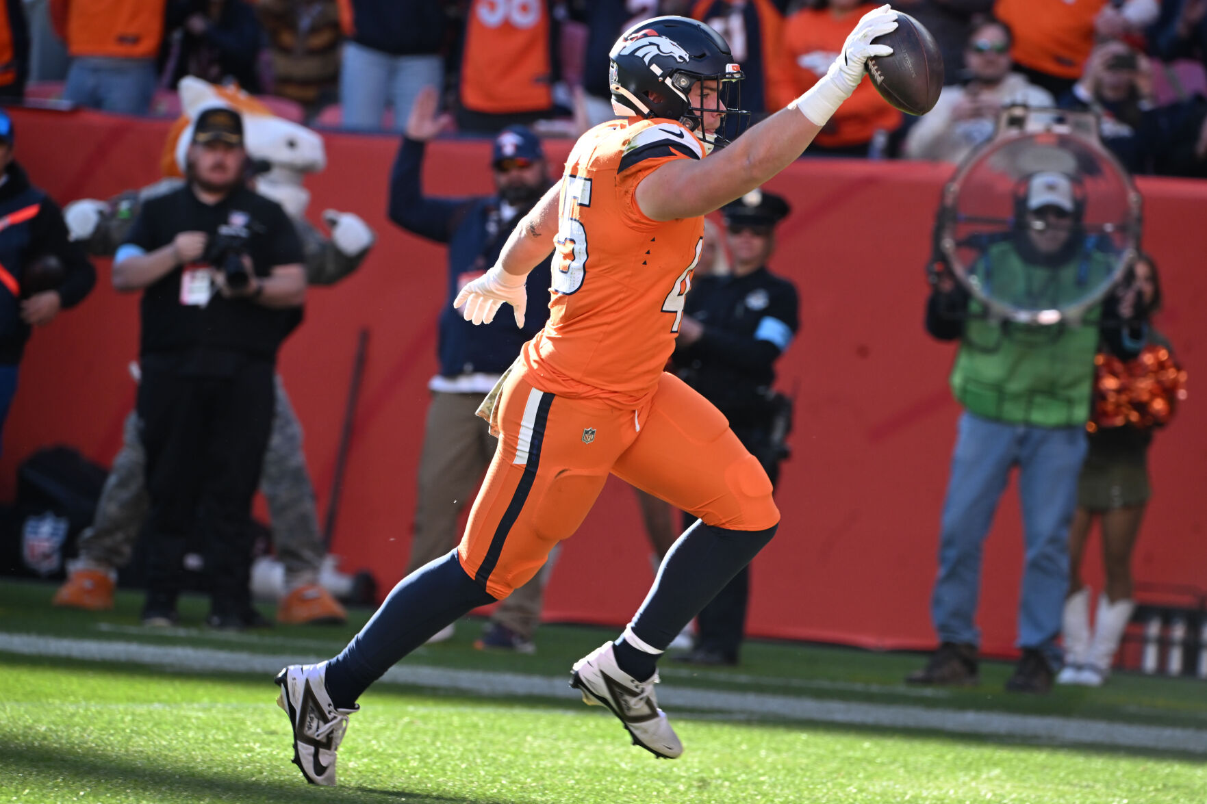 Broncos tight end Nate Adkins scores a touchdown in the first quarter during a game at Empower Field at Mile High on Sunday, Nov. 17, 2024. (Jerilee Bennett,The gazette)