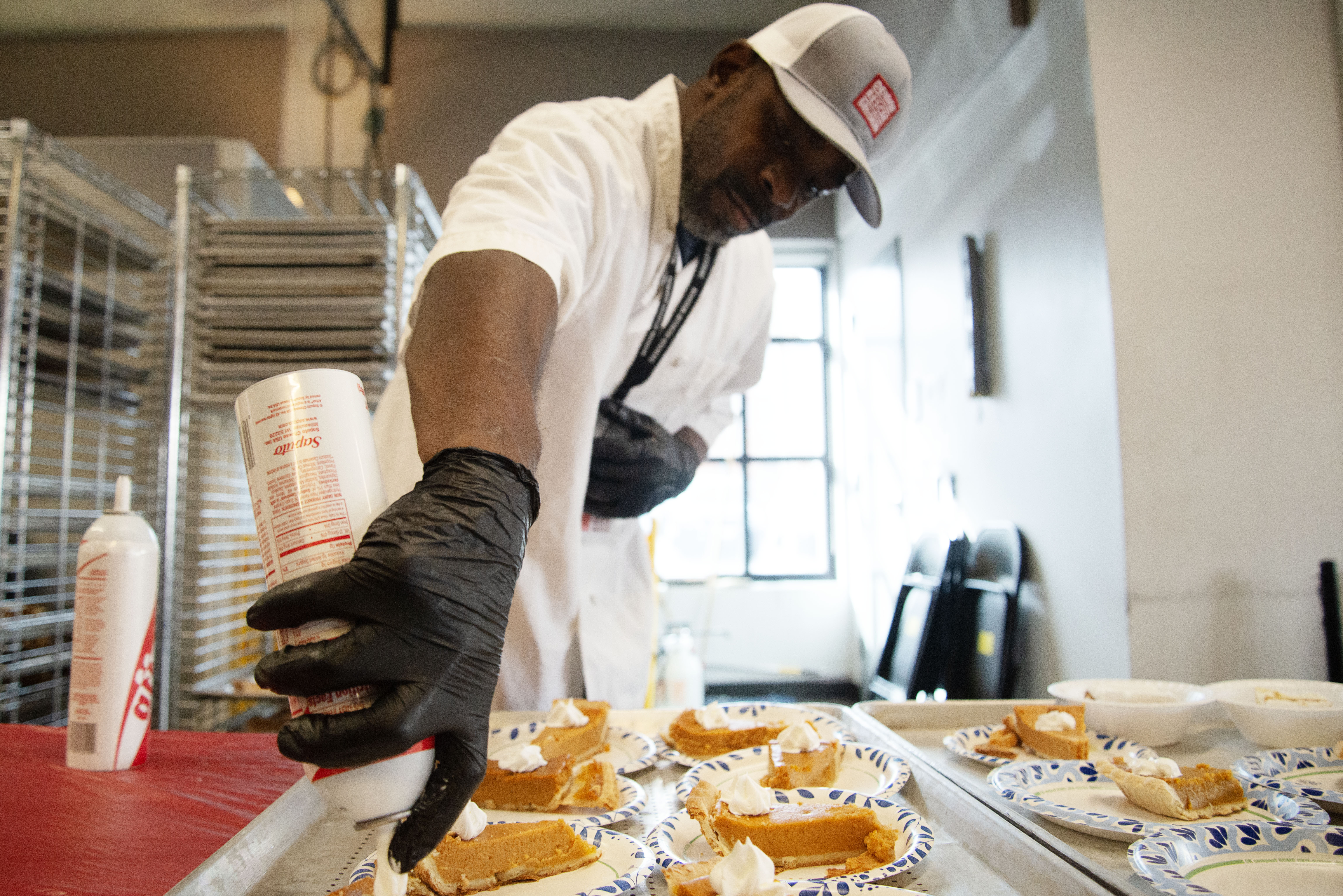 Edward Milton readies dessert for Denver's needy population the day before Thanksgiving on Wednesday, Nov. 27, 2024 at the Denver Rescue Mission's Lawrence St. location. 