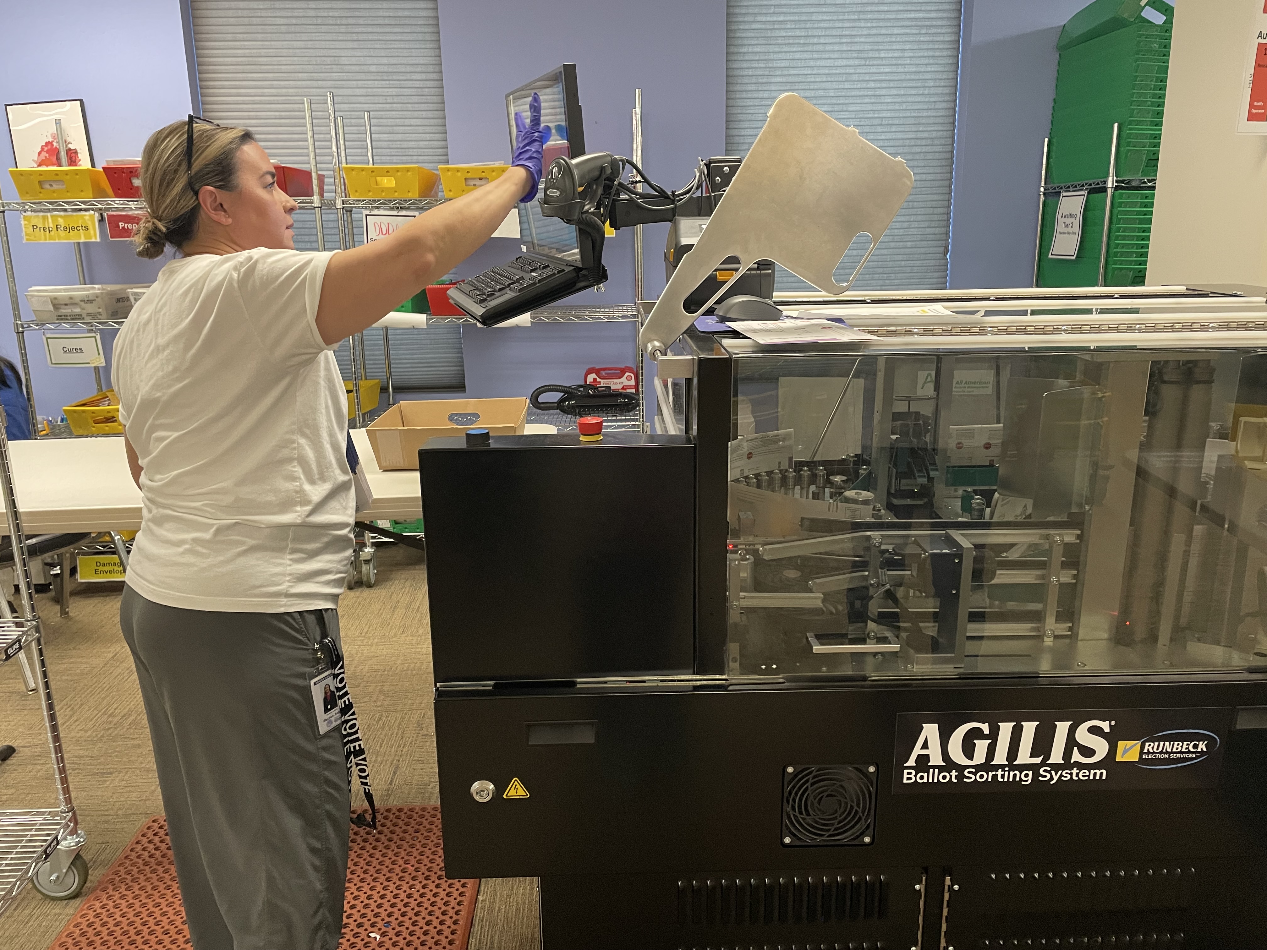 Agilis team leader Heather Leitch watches ballots enter the system. Each ballot has a voter-ID bar code. (CarolMcKinleyDenver Enterprise Reportercarol.mckinley@gazette.comhttps://denvergazette.com/content/tncms/avatars/5/c3/a0f/5c3a0fbe-1007-11ec-9e18-b7f42cfa4b0f.9565a0ce58866e86bcf18260621c2a46.png)