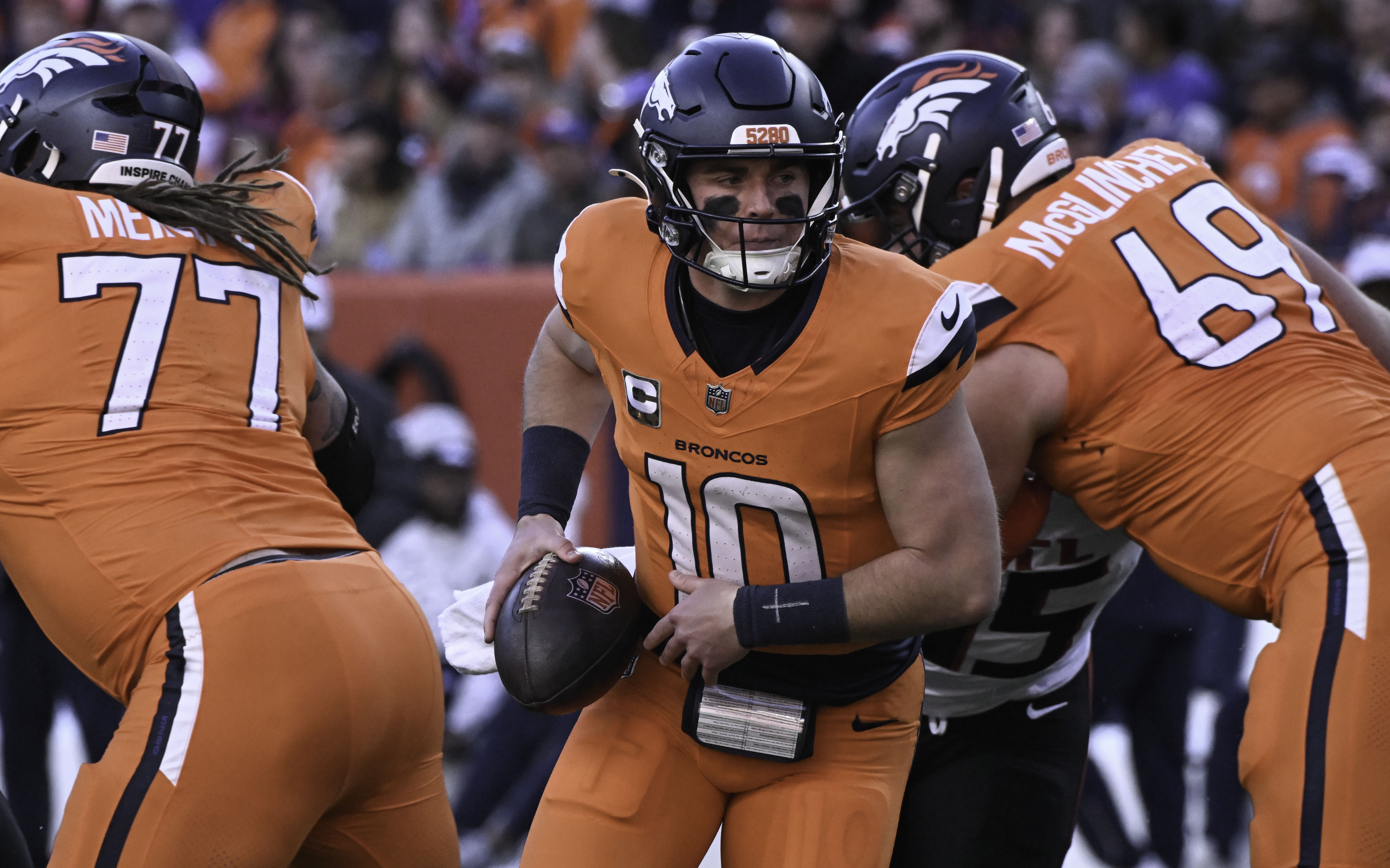 Denver Broncos quarterback Bo Nix (10) turns back to get ready to the hand off the ball during a game against the Falcons at Empower Field at Mile High on Sunday, Nov. 17, 2024. (Jerilee Bennett,The Gazette)
