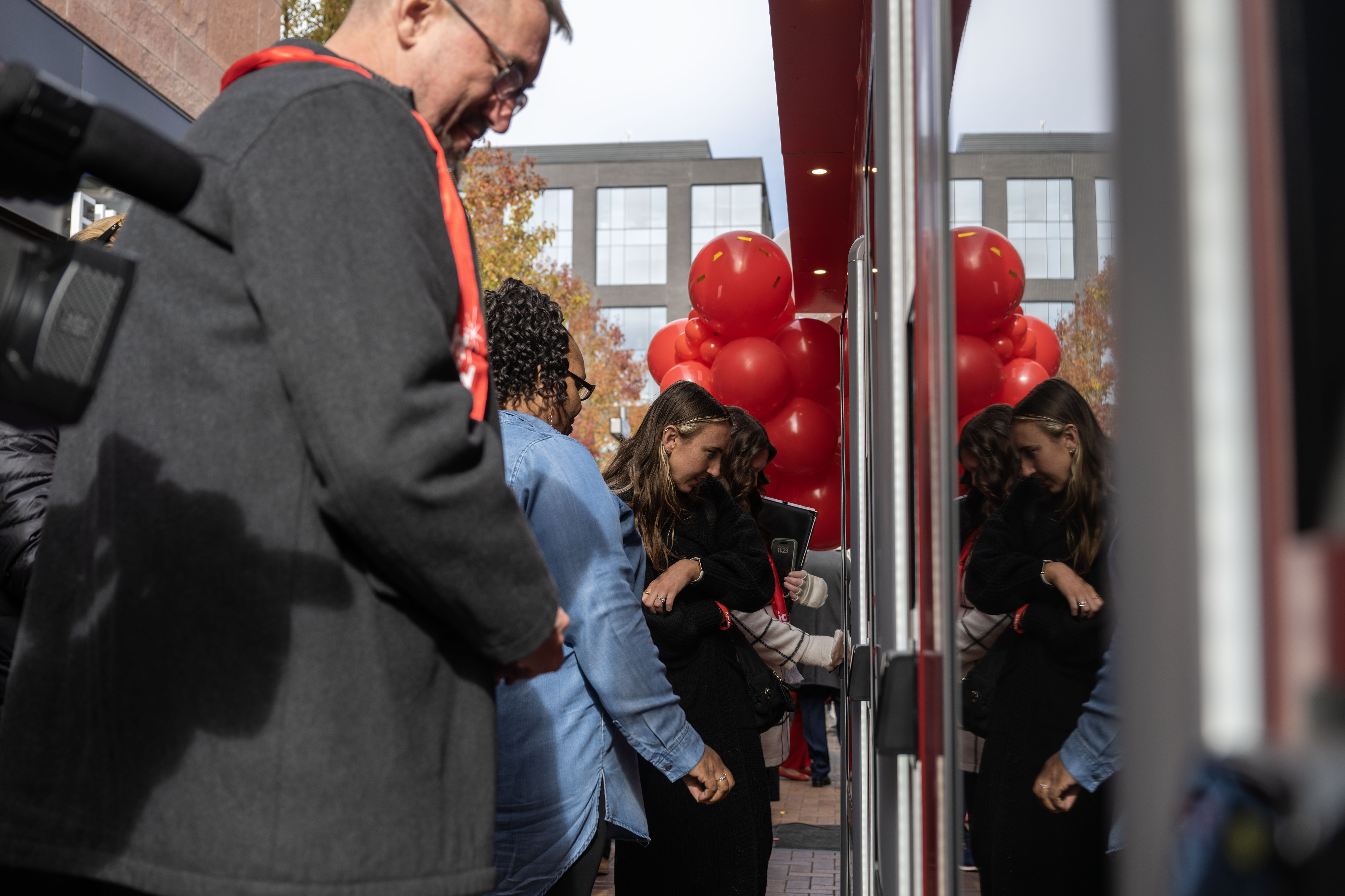 People buy gifts from a giving machine during an unwrapping event for Giving Machines in Cherry Creek North on Thursday, Nov. 21, 2024. The giving machines are customized vending machines that allow you to donate directly to one of five local/Denver-metro charities or two global charities. (Stephen Swofford, Denver Gazette) (StephenSwoffordPhotographerstephen.swofford@gazette.comhttps://secure.gravatar.com/avatar/1ddcaf11c5d70eaa58546ddc4e038687?d=mm&r=g)