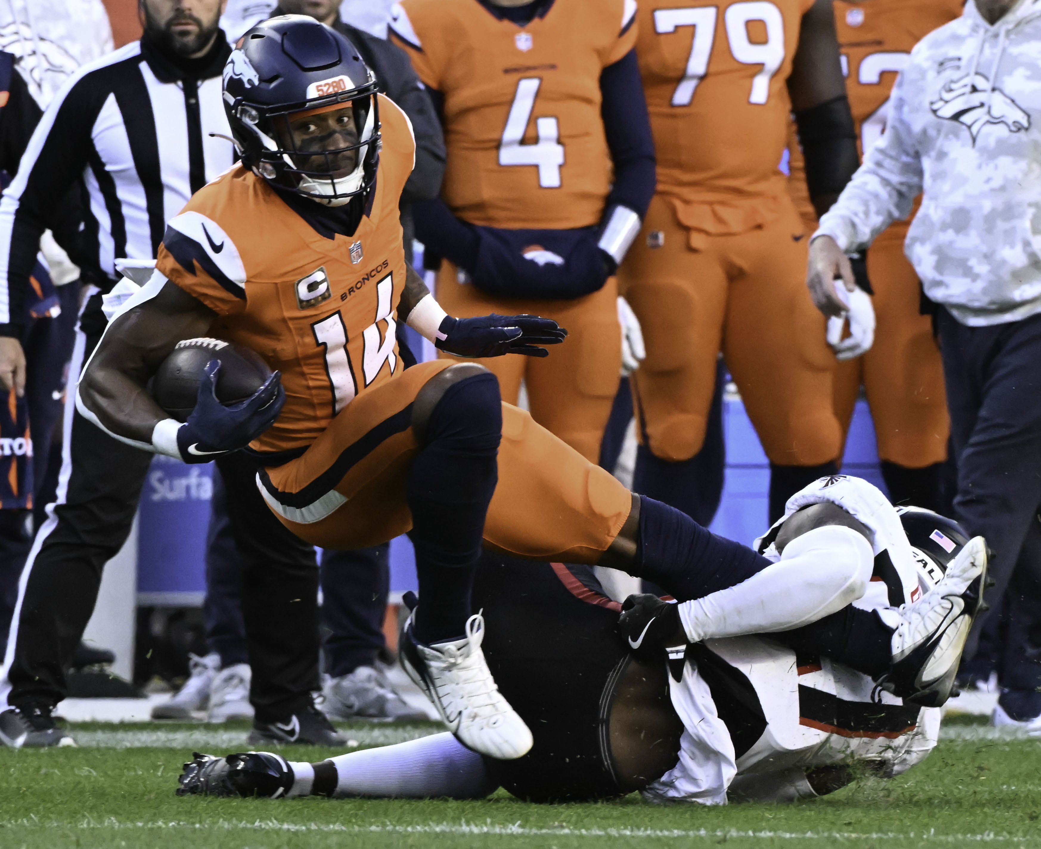Denver Broncos wide receiver Courtland Sutton (14) leans forward to get a few more yards during the second quarter of a game at Empower Field at Mile High on Sunday, Nov. 17, 2024. The Broncos defeated the Falcons 38-6. (Jerilee Bennett,The Gazette)