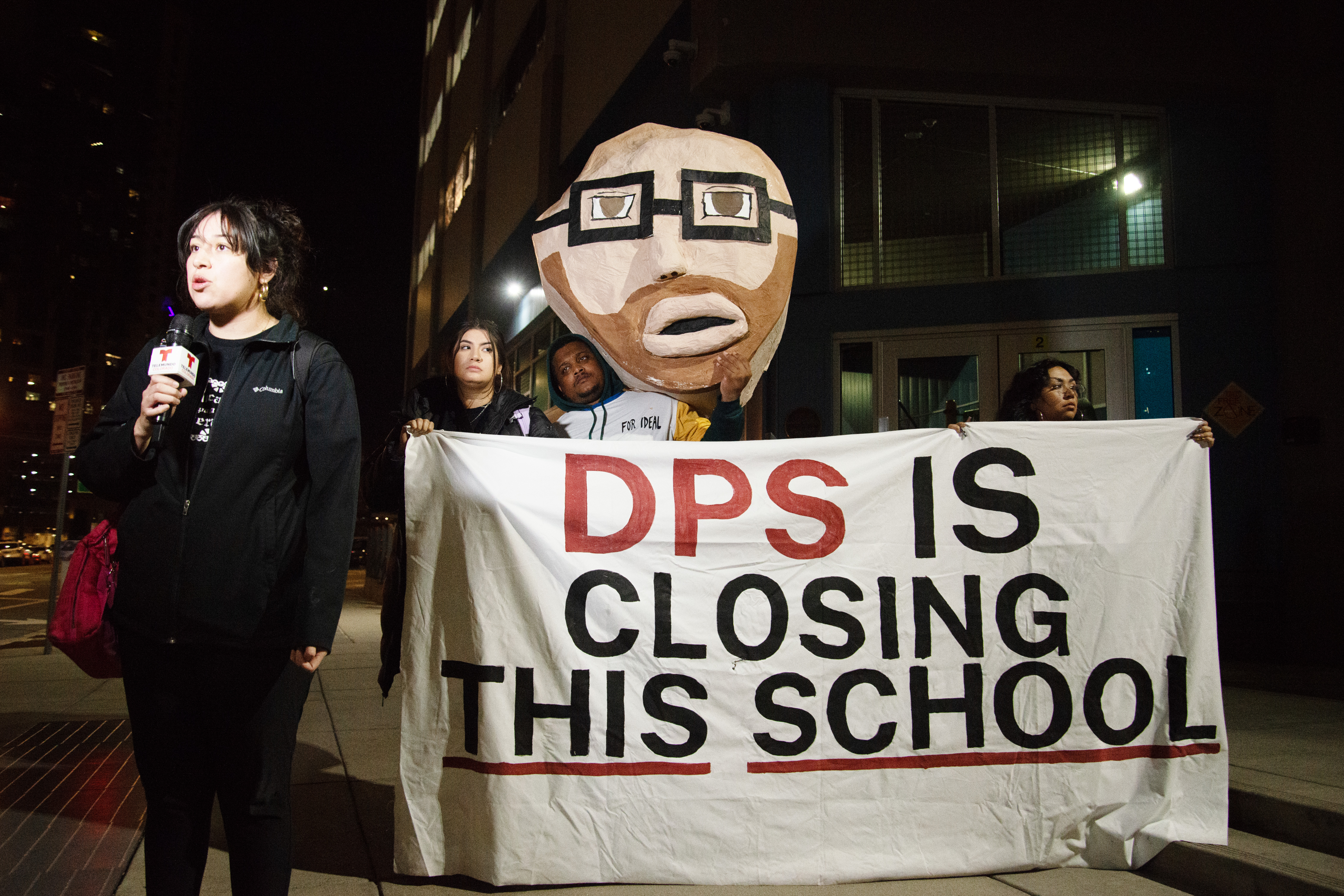 Protestors with Movimiento Poder give interviews to the press with an effigy of Dr. Alex Marrero after being escorted out of the Denver Public Schools Board of Education meeting for shouting