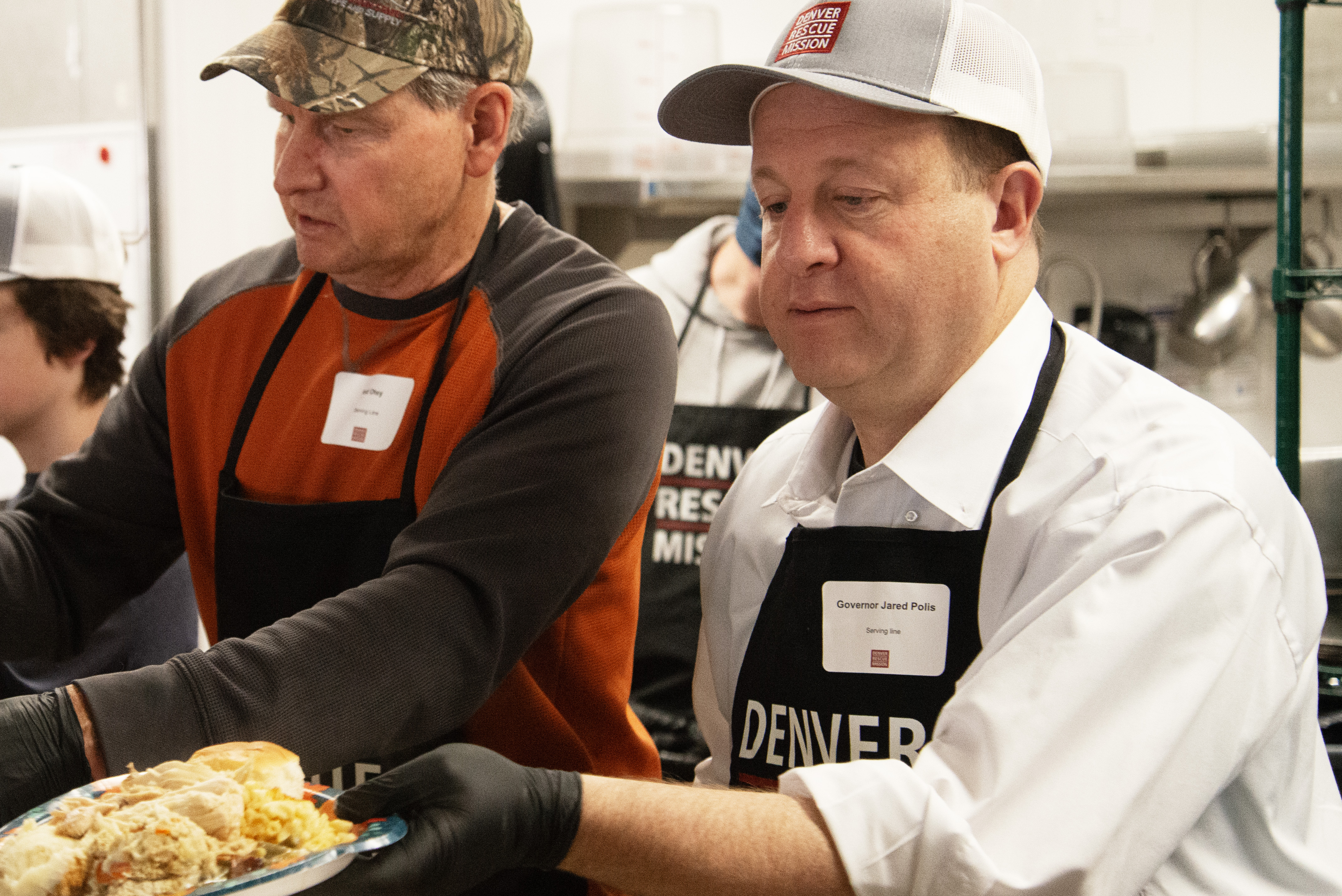 Gov. Jared Polis readies Thanksgiving meals for Denver's needy population alongside other volunteers and staff of the Denver Rescue Mission the day before the holiday at the group's Lawrence Street location on Wednesday, Nov. 27, 2024. Staff counted 537 Thanksgiving meals served at the Lawrence Street location by the end of the day and estimated around 600 more at the group's North Denver location. (TomHellauerMultimedia Producertom.hellauer@denvergazette.comhttps://denvergazette.com/content/tncms/avatars/f/9e/622/f9e6228a-3b6b-11ed-bf10-fbb71fa8e421.f54b911252c540f1d61709edc4727a39.png)