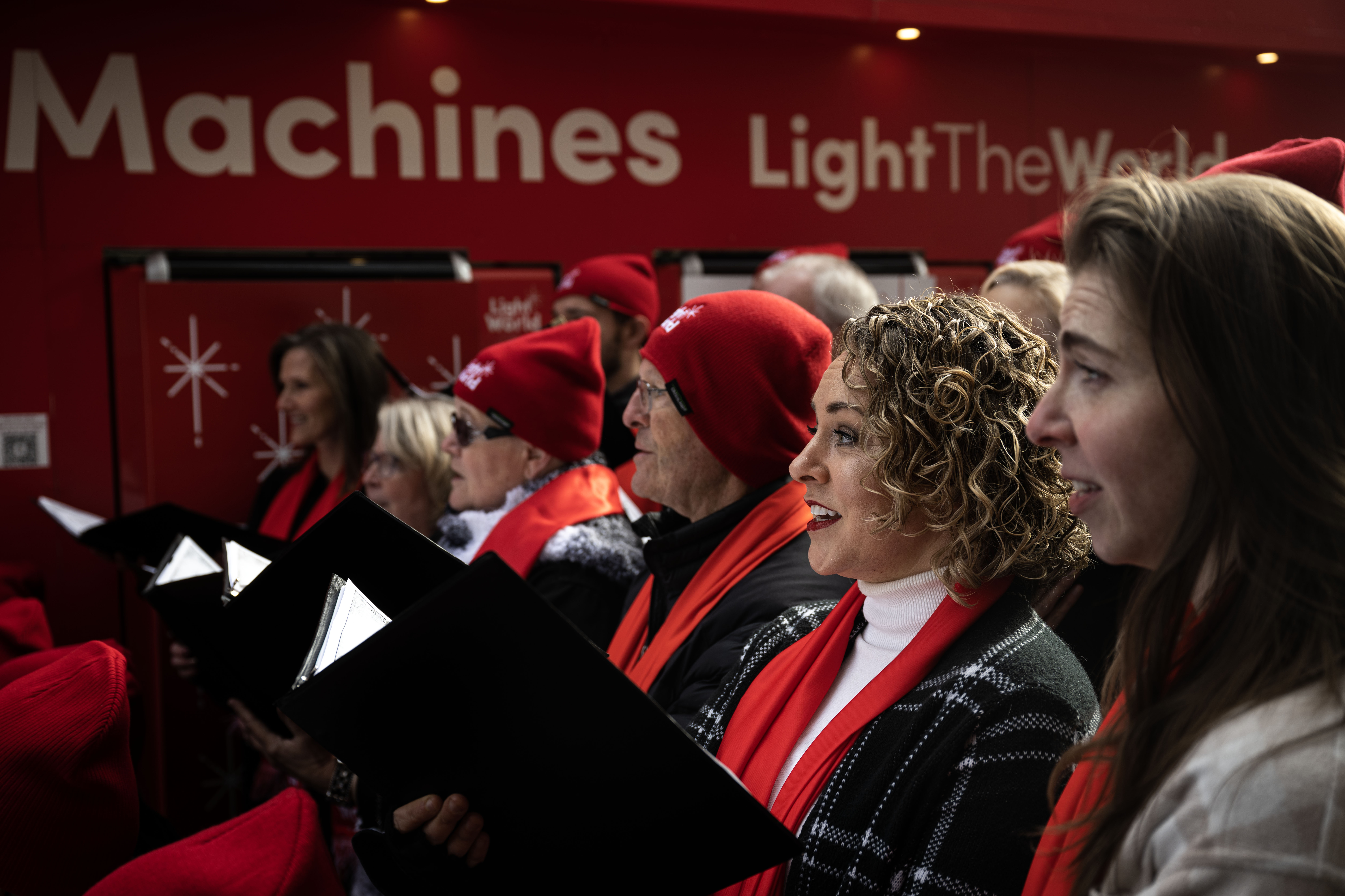 Members of a holiday chorus perform during an unwrapping event for Giving Machines in Cherry Creek North on Thursday, Nov. 21, 2024. The giving machines are customized vending machines that allow you to donate directly to one of five local/Denver-metro charities or two global charities. (Stephen Swofford, Denver Gazette) (StephenSwoffordPhotographerstephen.swofford@gazette.comhttps://secure.gravatar.com/avatar/1ddcaf11c5d70eaa58546ddc4e038687?d=mm&r=g)
