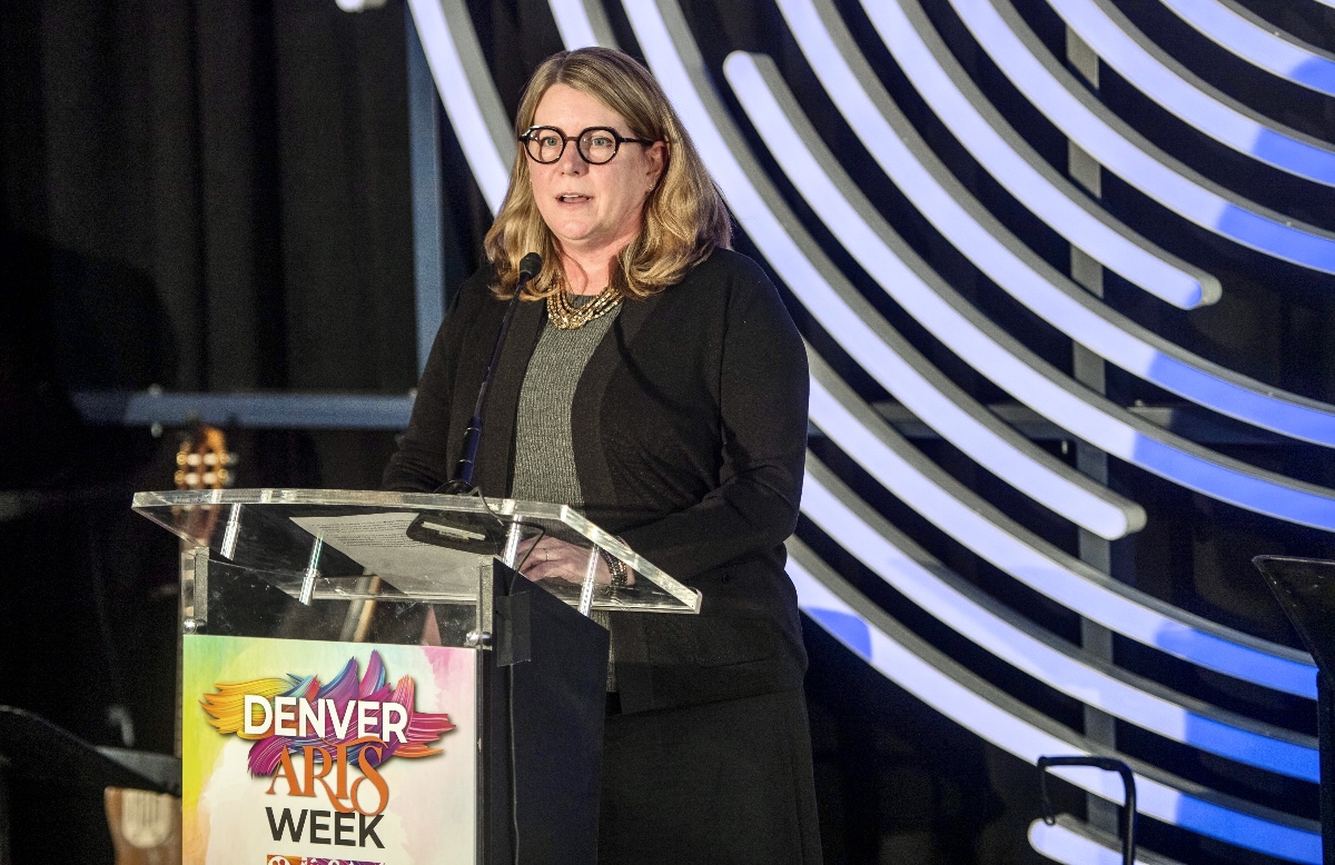Gretchen Hollrah, executive director of Denver Arts and Venues, speaking at Denver's Dazzle jazz club to help kick off Denver Arts Week on Nov. 1, 2024. (JOHN MOORE, DENVER GAZETTE)
