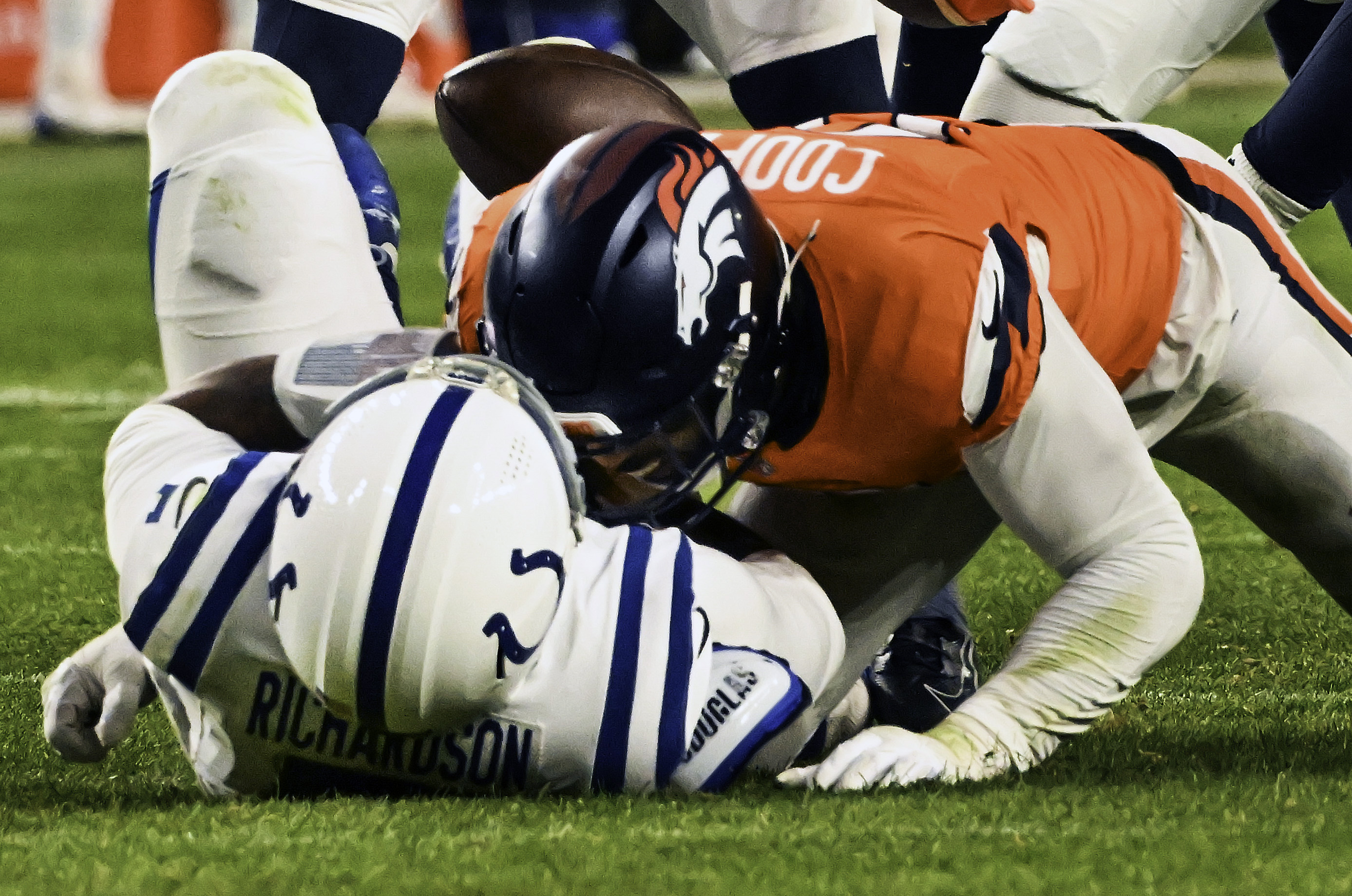 Denver Broncos linebacker Jonathon Cooper (0) sacks Indianapolis Colts quarterback Anthony Richardson (5) and causes a fumble recovered by the Broncos during the second half of a game against the Colts.The Broncos defeated the Colts 31-13 at Empower Field at Mile High on Sunday, Dec. 15, 2024. (Jerilee Bennett,The Gazette)