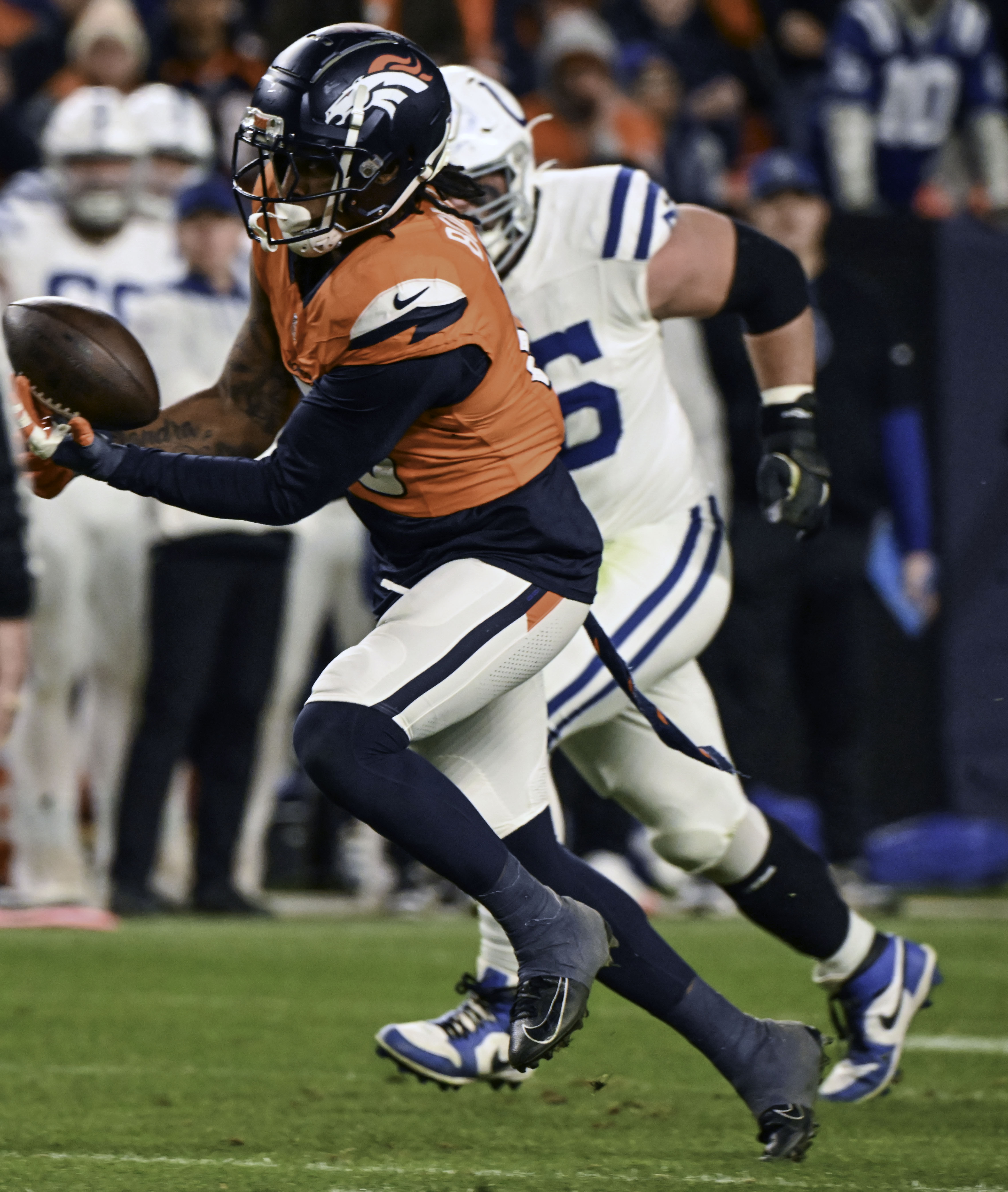 Denver Broncos linebacker Nik Bonitto (15) intercepts the ball during a game against the Colts on Sunday, Dec. 15, 2024. (Jerilee Bennett,The Gazette)