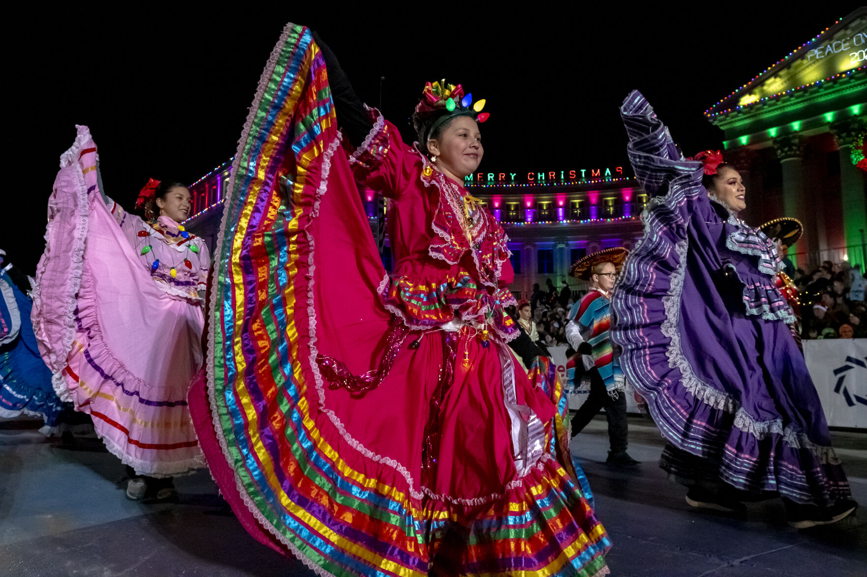 Dancers from the Colorado Mestizo dance in front of the Denver City Council building on Bannock Street in Denver on Saturday, Dec. 7, 2024 during the 9NEWS 50th Anniversary Parade of Lights. (Laura Domingue/Special to the Gazette) (LAURA DOMINGUE/Special to The Denver Gazette)
