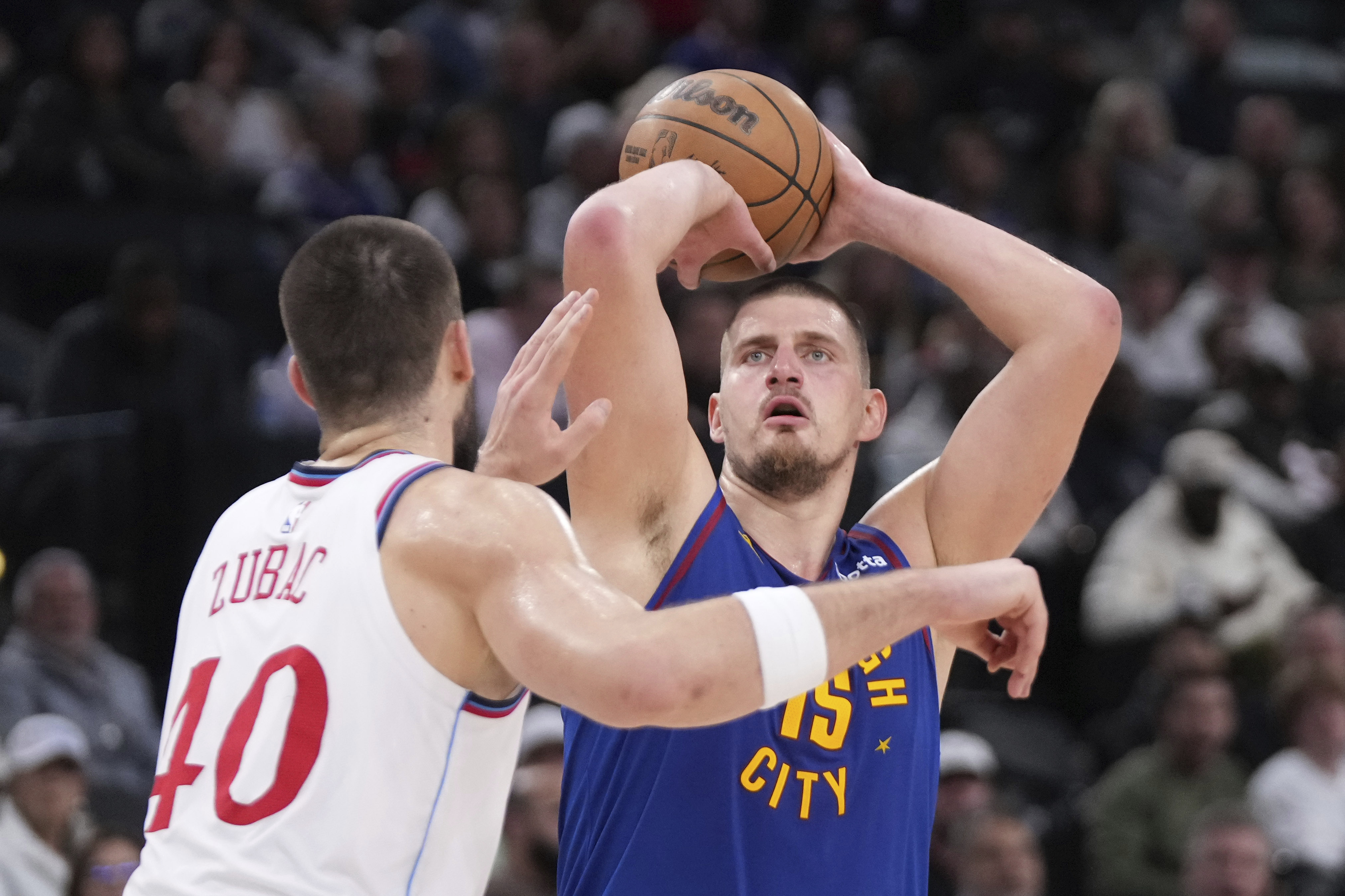 Denver Nuggets center Nikola Jokic, right, shoots as Los Angeles Clippers center Ivica Zubac defends during the first half of an NBA basketball game, Sunday, Dec. 1, 2024, in Inglewood, Calif. (AP Photo/Mark J. Terrill) (Mark J. Terrill)