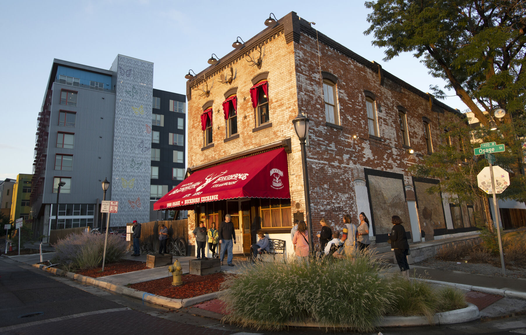 Customers wait for their reservations outside Denver’s oldest restaurant, the Buckhorn Exchange, on Sept. 22. The restaurant, which opened in 1893, is now surrounded by modern apartments and a light rail station across the street. (Christian Murdock/The Gazette)