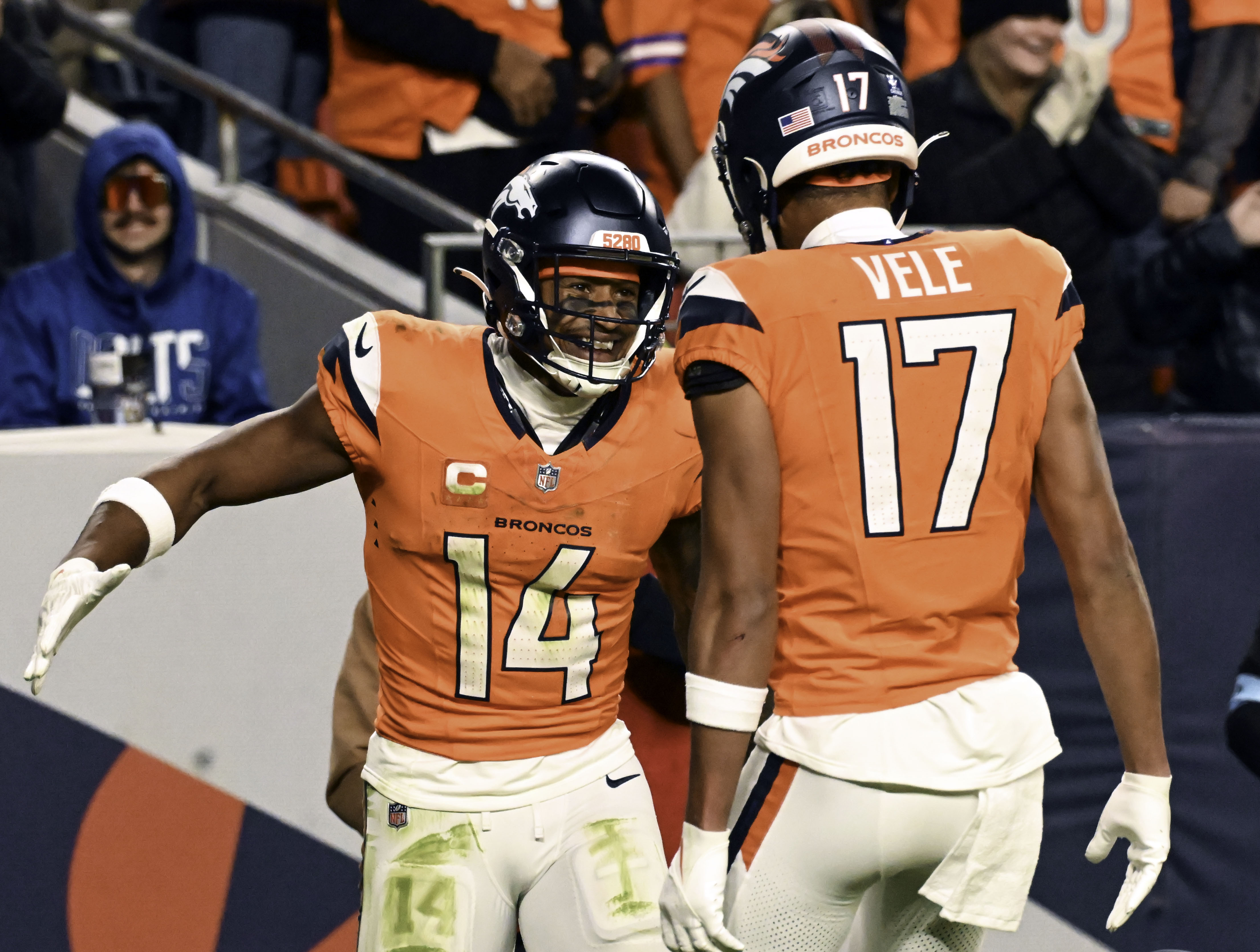 Denver Broncos wide receiver Courtland Sutton (14) celebrates with Denver Broncos wide receiver Devaughn Vele (17) after Sutton during a game against the Colts on Sunday, Dec. 15, 2024. (Jerilee Bennett,The Gazette)