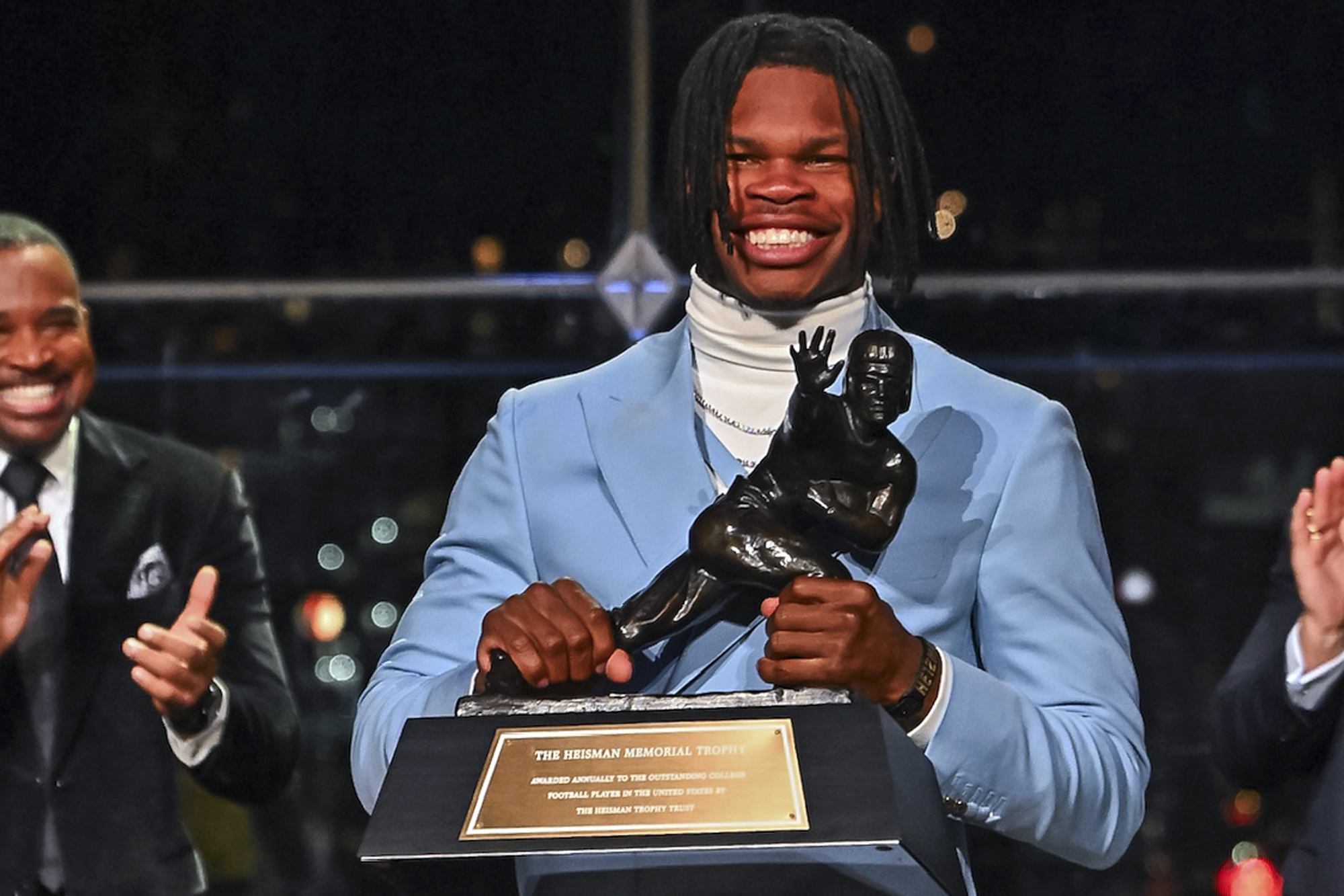 Colorado’s Travis Hunter holds the trophy after winning the Heisman Trophy as the outstanding player in college football, Saturday, Dec. 14, 2024, in New York. (Todd Van Emst/Heisman Trust via AP, Pool) (Todd Van Emst)