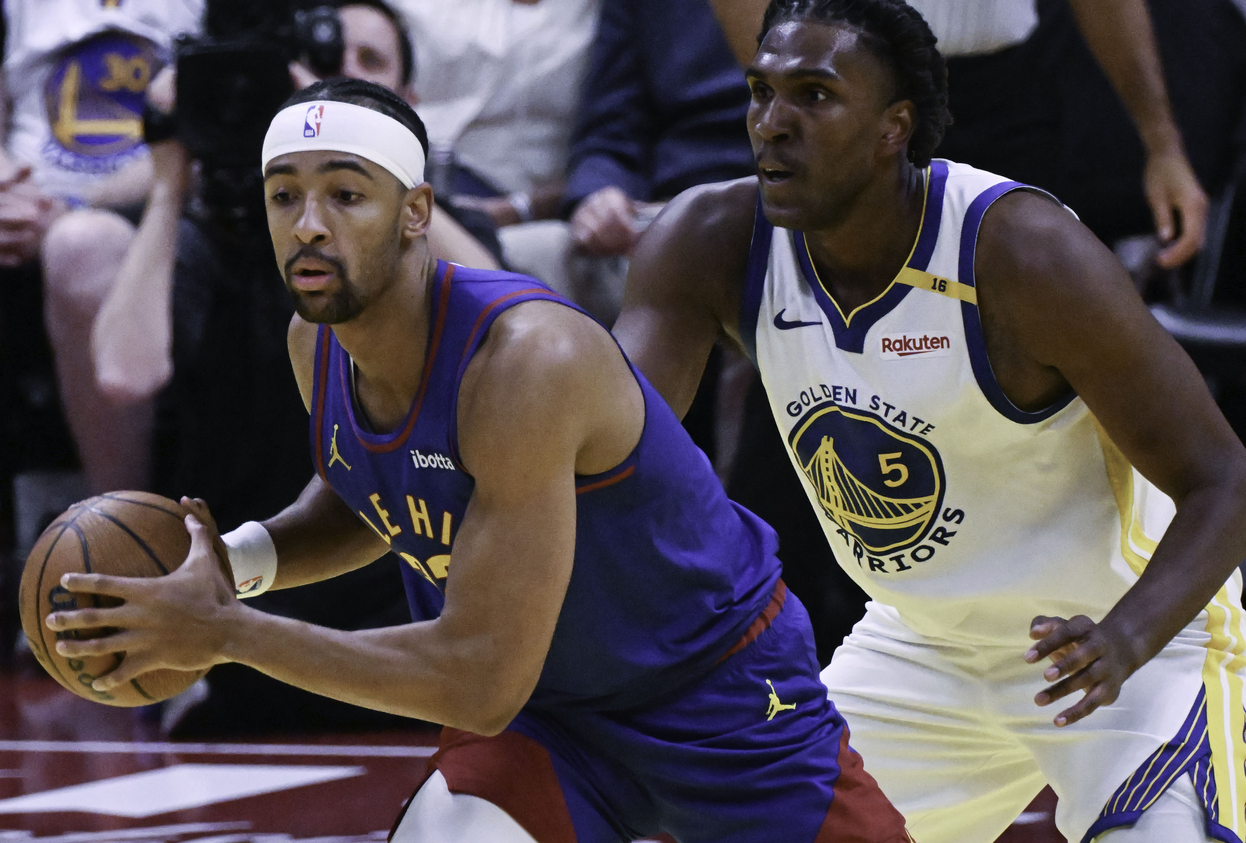 Denver Nuggets forward Zeke Nnaji (22) is defended by Golden State Warriors forward Kevon Looney (5) during an Emirates NBA Cup Group Play game at Ball Arena on Tuesday, Dec. 3, 2024. The Nuggets defeated the Warriors 119-115. (Jerilee Bennett,The Gazette)