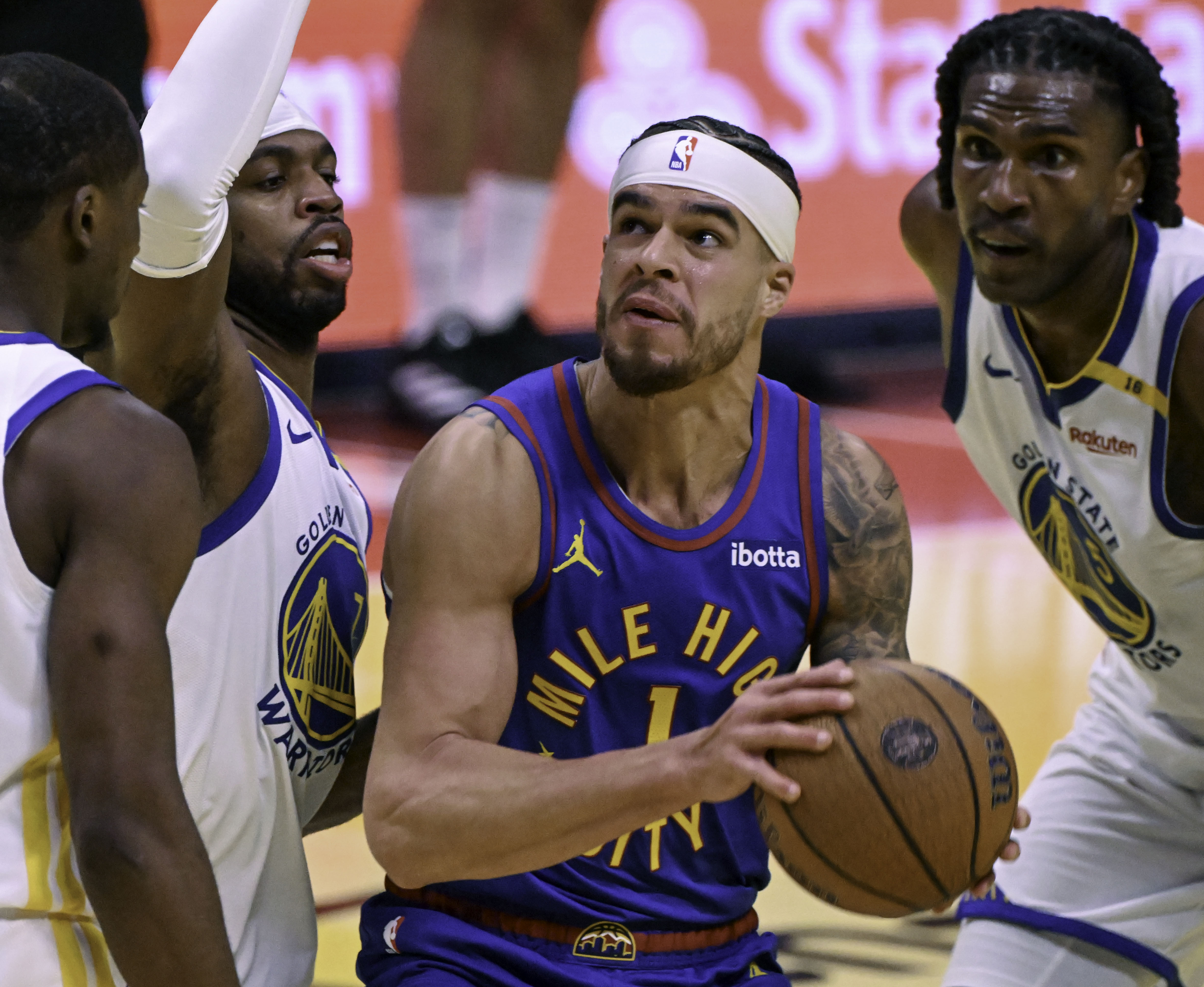 Denver Nuggets forward Michael Porter Jr. (1) looks up towards the basket surround by Warriors during an Emirates NBA Cup Group Play game against the Warriors at Ball Arena on Tuesday, Dec. 3, 2024. The Nuggets defeated the Warriors 119-115. (Jerilee Bennett,The Gazette)