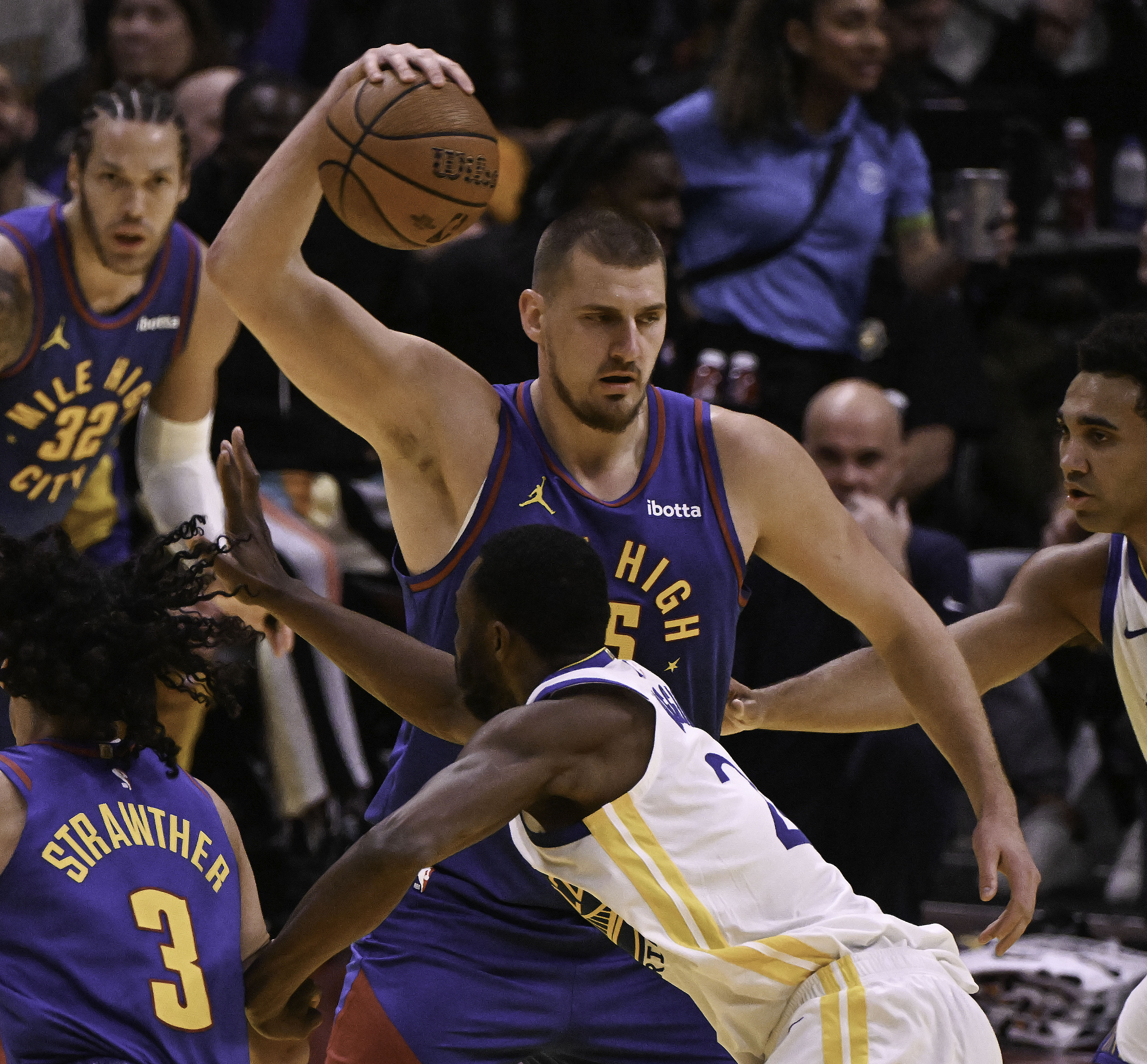 Denver Nuggets center Nikola Jokic (15) pays keep away with the Golden State Warriors during the second quarter of an Emirates NBA Cup Group Play game at Ball Arena on Tuesday, Dec. 3, 2024. (Jerilee Bennett, The Gazette)