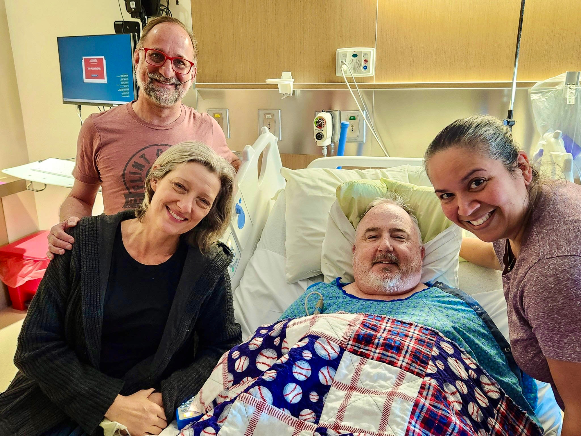 Eryc Eyl and Mare Trevathan, left, with Lee Anderson and GeRee Hinshaw, two days after Trevathan donated her kidney to Anderson, whose organ function had dropped to 10%. They are pictured on April 5, 2024, at the Anschutz Medical Center. (COURTESY GERREE HINSHAW)