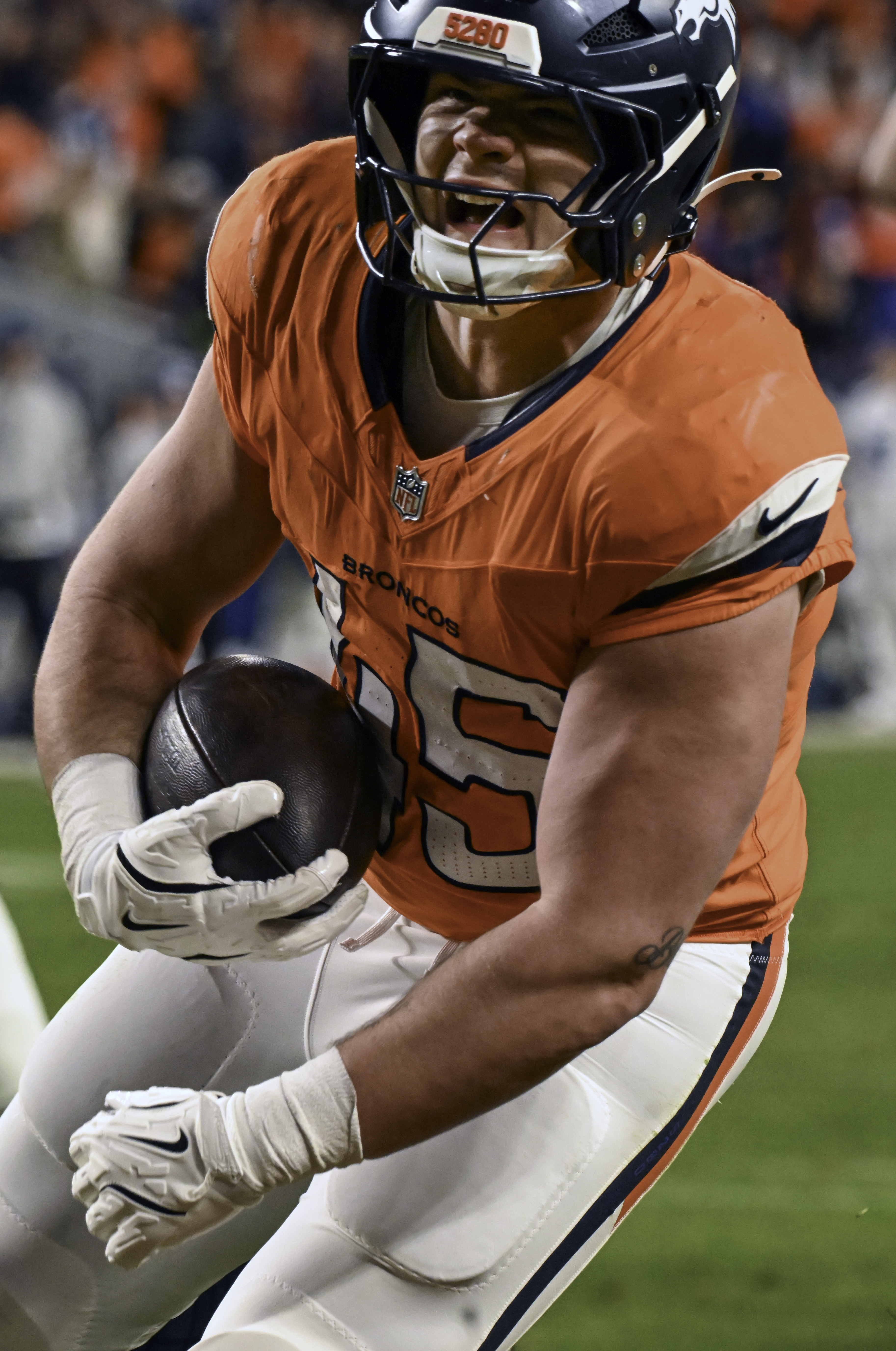 Denver Broncos tight end Nate Adkins (45) celebrates while crossing the goal line during the second half of a game against the Colts.The Broncos defeated the Colts 31-13 at Empower Field at Mile High on Sunday, Dec. 15, 2024. (Jerilee Bennett,The Gazette)
