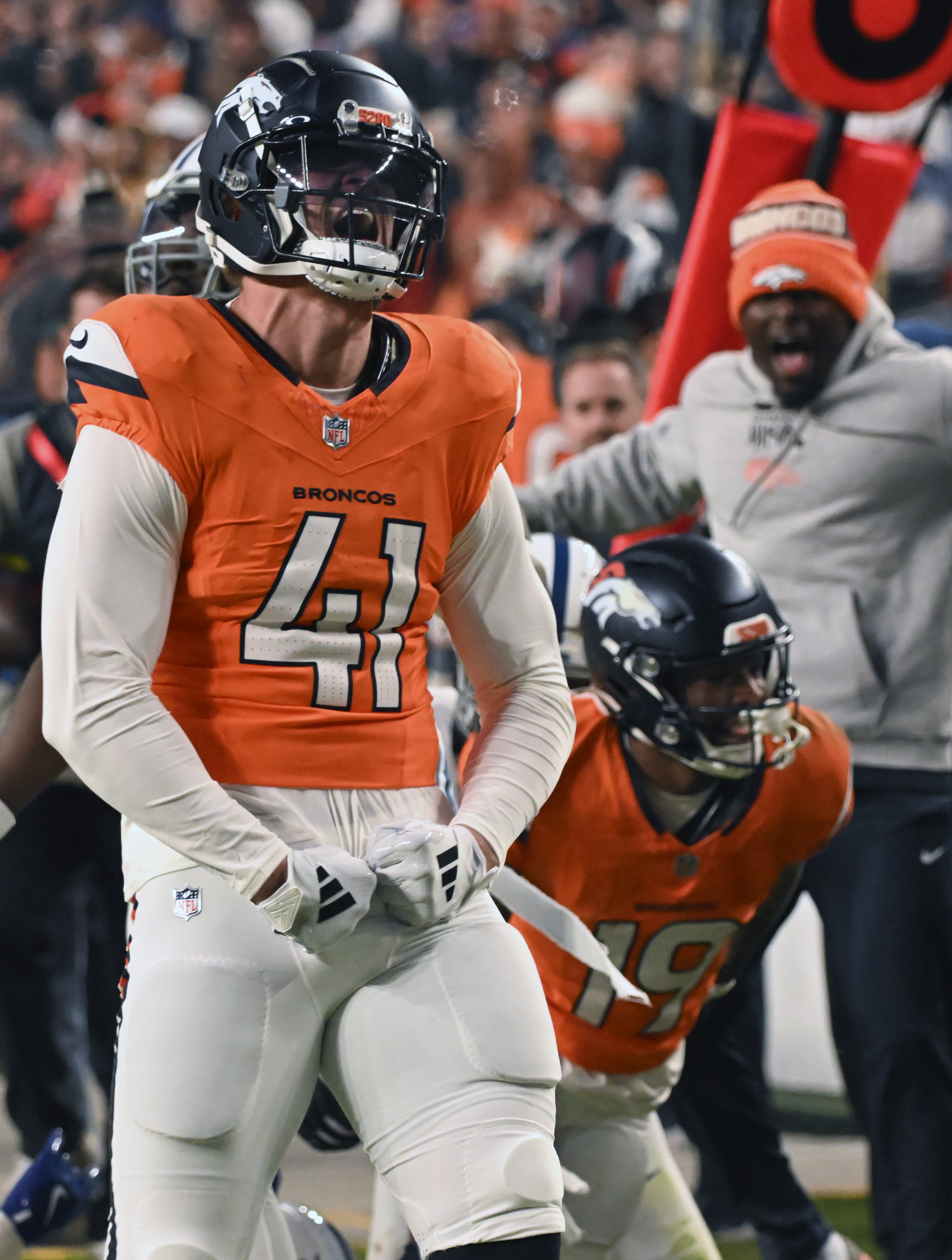 Denver Broncos linebacker Drew Sanders (41) celebrates Marvin Mims 70 yard punt return during the second half of a game against the Colts.The Broncos defeated the Colts 31-13 at Empower Field at Mile High on Sunday, Dec. 15, 2024. (Jerilee Bennett,The Gazette)