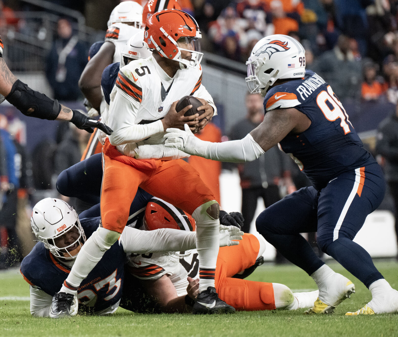 Cleveland Browns quarterback Jameis Winston (5) is pressured by Broncos defensive tackle D.J. Jones (93) and defensive end John Franklin-Myers (98) during the second half of Denver's 41-32 victory on Dec. 2 at Empower Field at Mile High. (Christian Murdock, The Gazette)