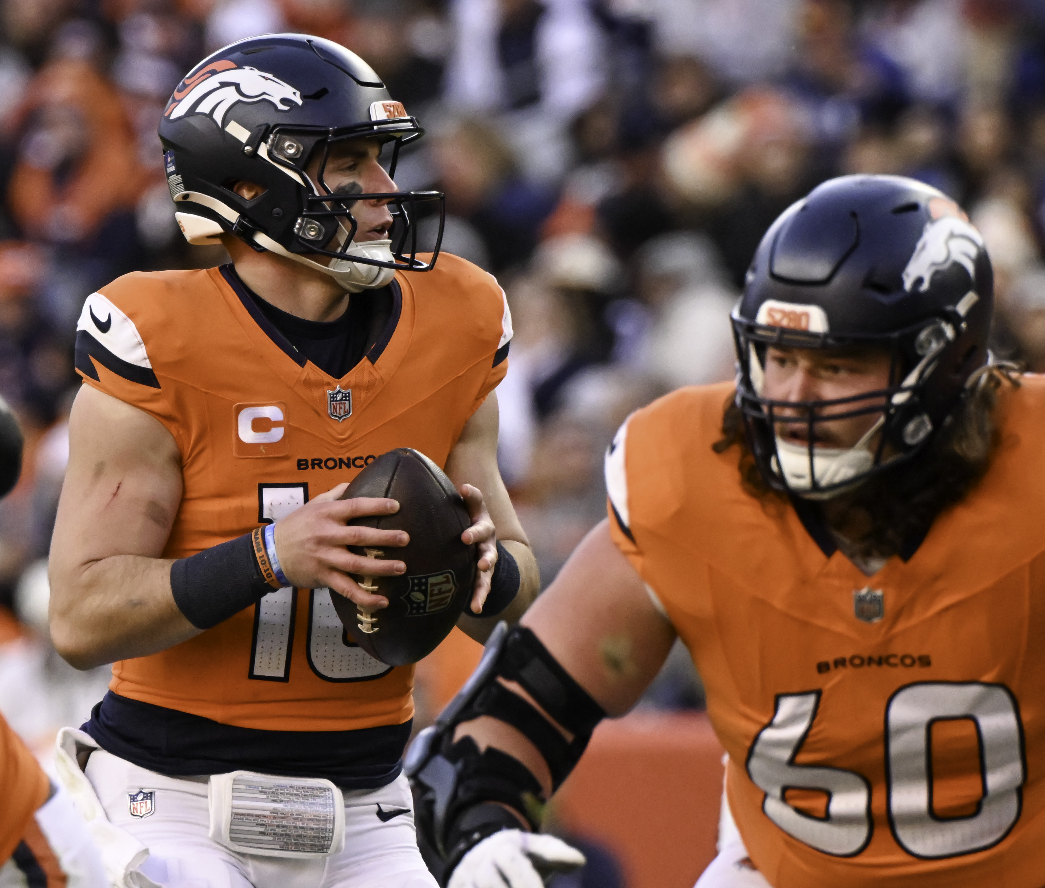 Denver Broncos quarterback Bo Nix (10) looks down the field before passing against the Colts. The Broncos defeated the Colts 31-13 at Empower Field at Mile High on Sunday. (Jerilee Bennett,The Gazette)