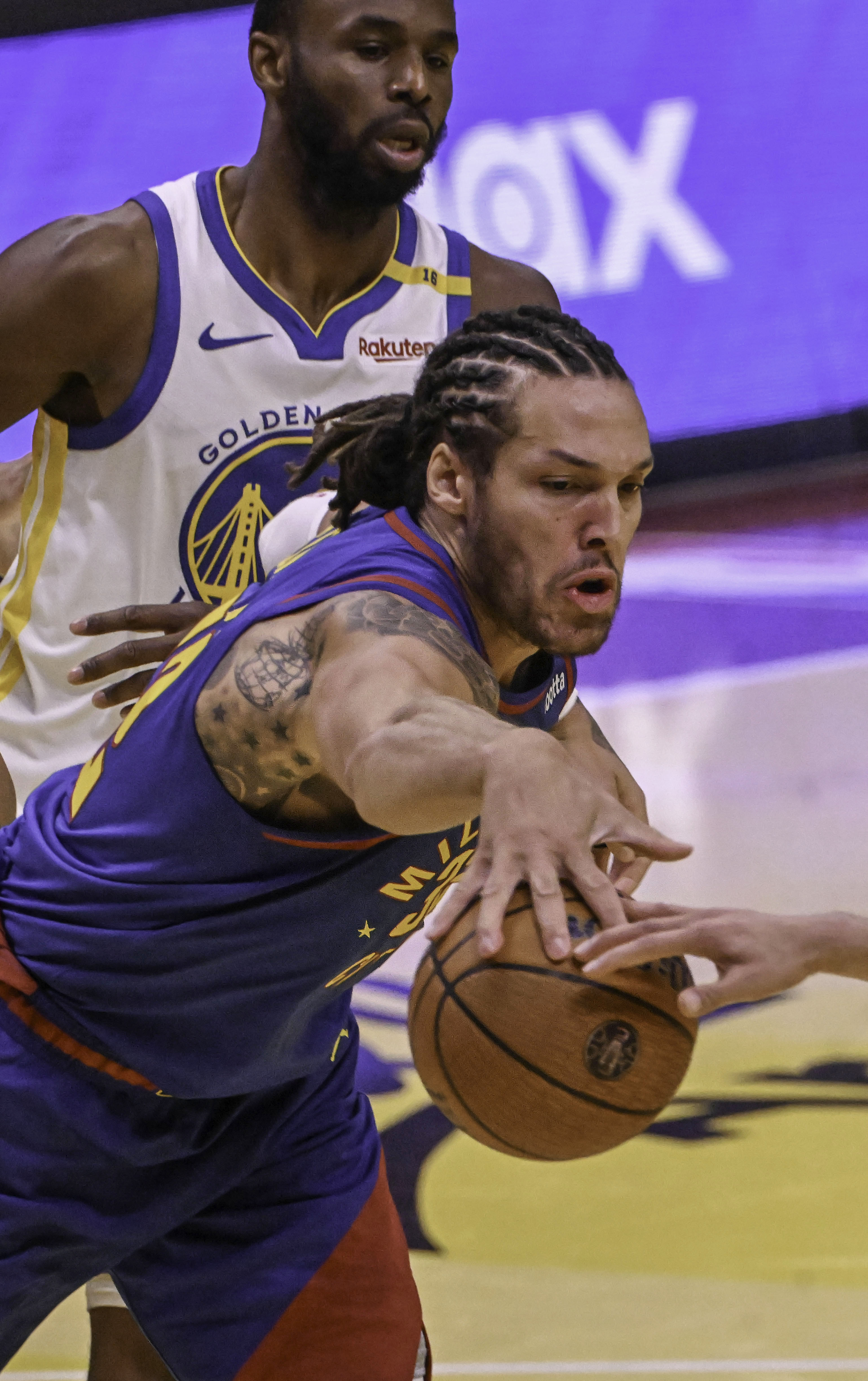 Denver Nuggets forward Aaron Gordon (32) goes after a rebound during an Emirates NBA Cup Group Play game against the Warriors at Ball Arena on Tuesday, Dec. 3, 2024. (Jerilee Bennett, The Gazette)