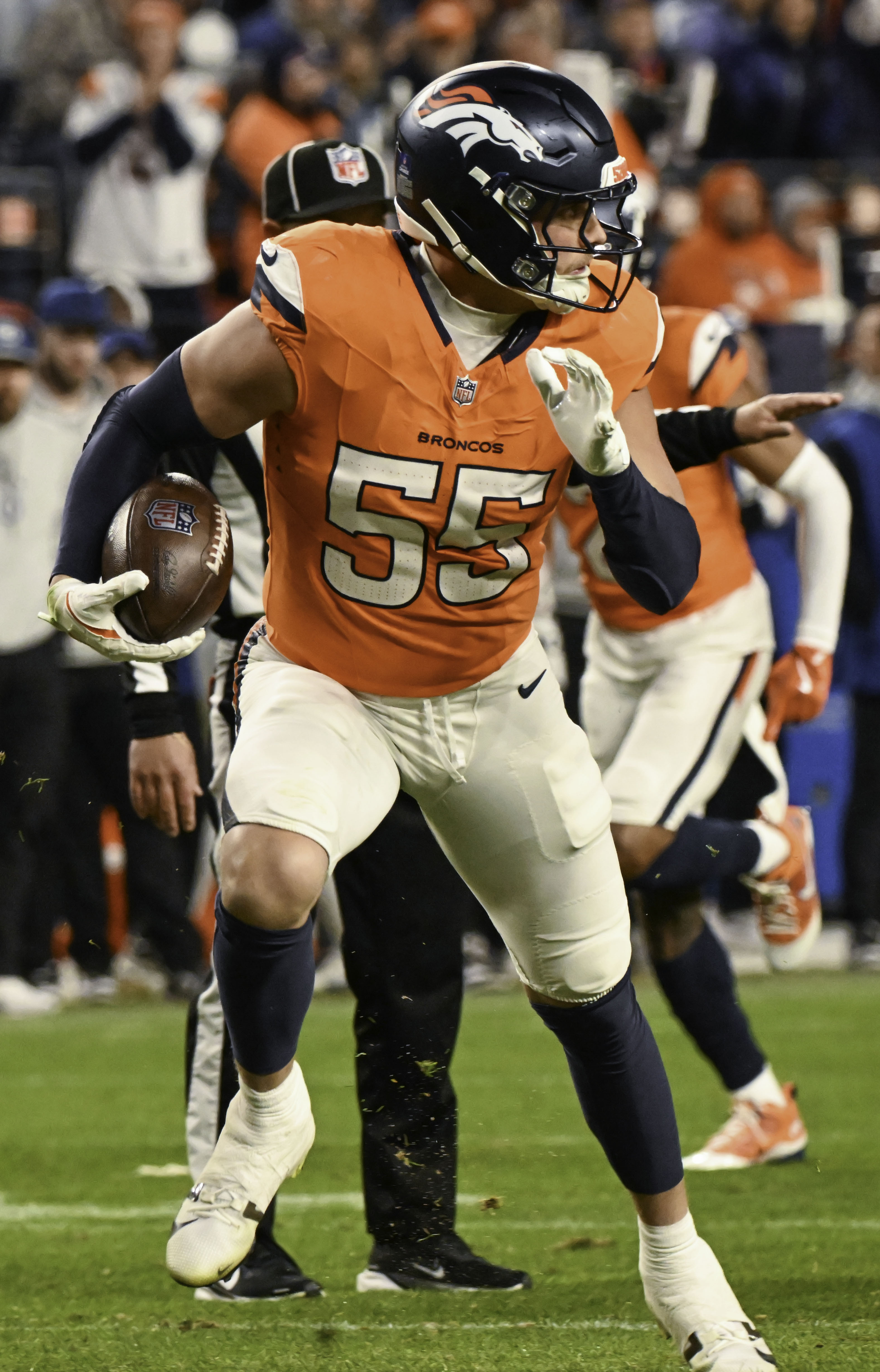 Denver Broncos linebacker Cody Barton (55) runs with the ball with what he thought might be a fumbled ball during a game against the Colts on Sunday, Dec. 15, 2024. (Jerilee Bennett,The Gazette)