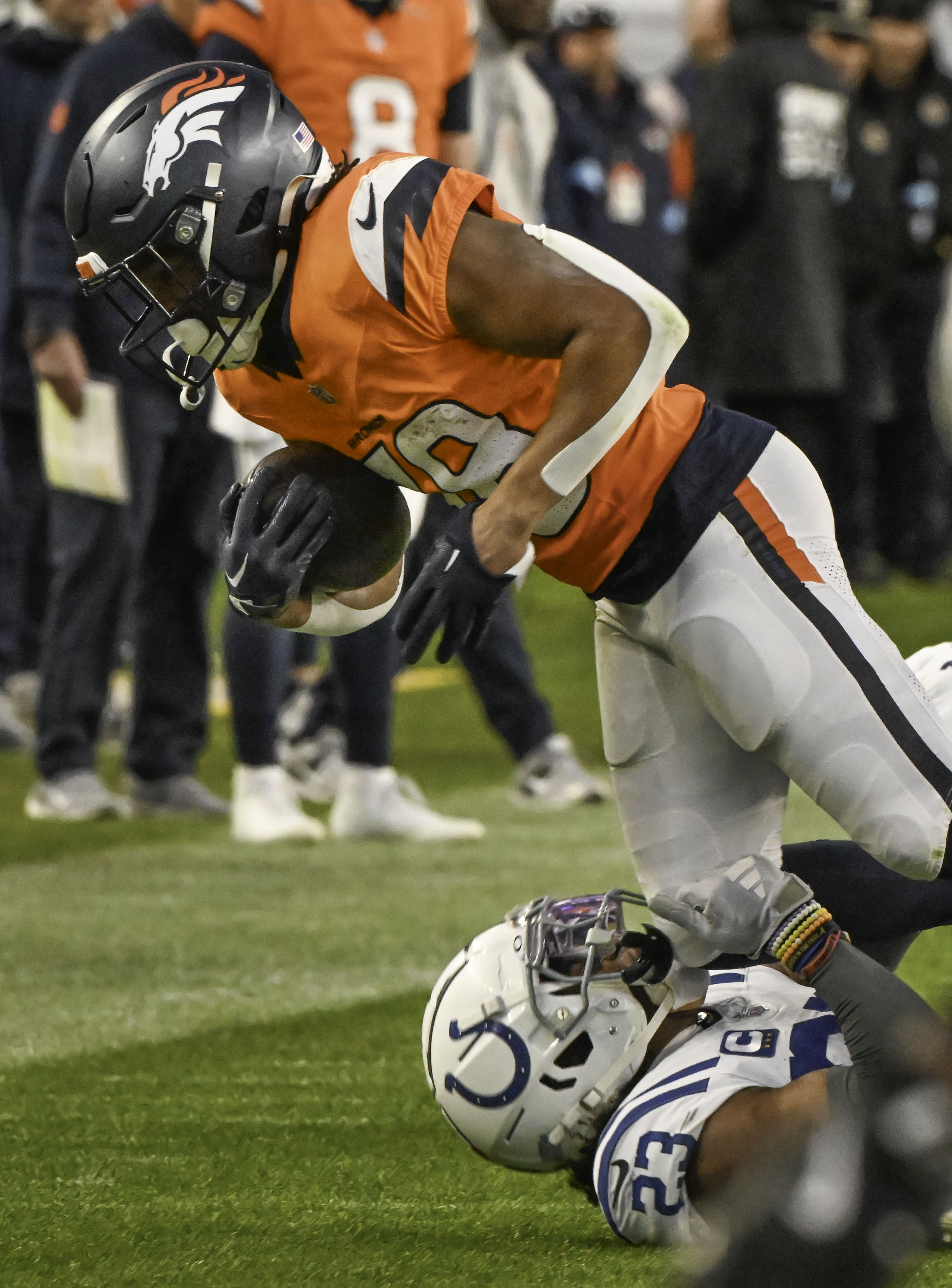 Denver Broncos running back Jaleel McLaughlin (38) leans for more yards during a game against the Colts on Sunday, Dec. 15, 2024. (Jerilee Bennett,The Gazette)