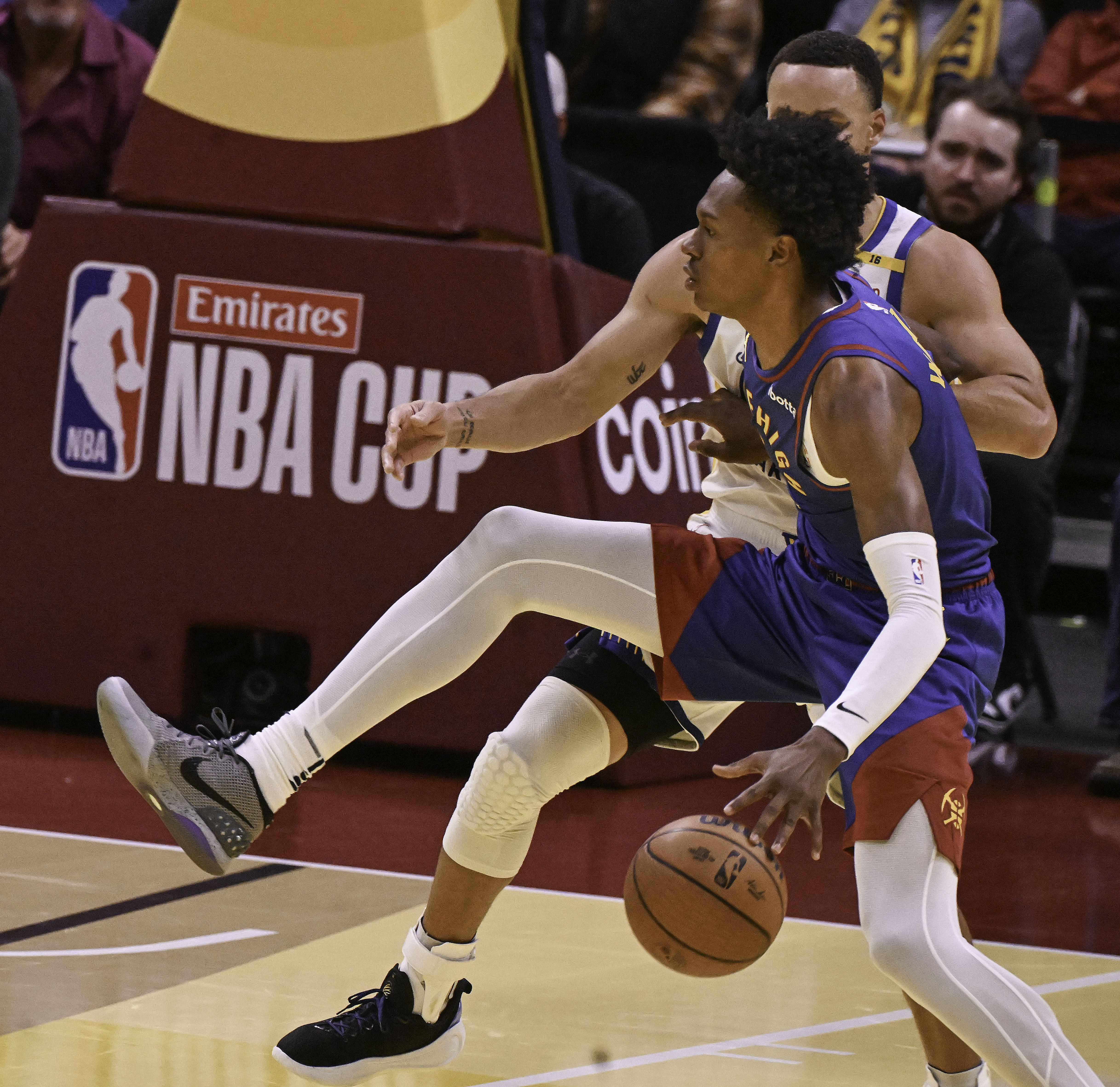 Denver Nuggets forward Peyton Watson (8) is pressured by Golden State Warriors guard Stephen Curry (30) during the second quarter of an Emirates NBA Cup Group Play game against the Warriors at Ball Arena on Tuesday, Dec. 3, 2024. (Jerilee Bennett,The Gazette)