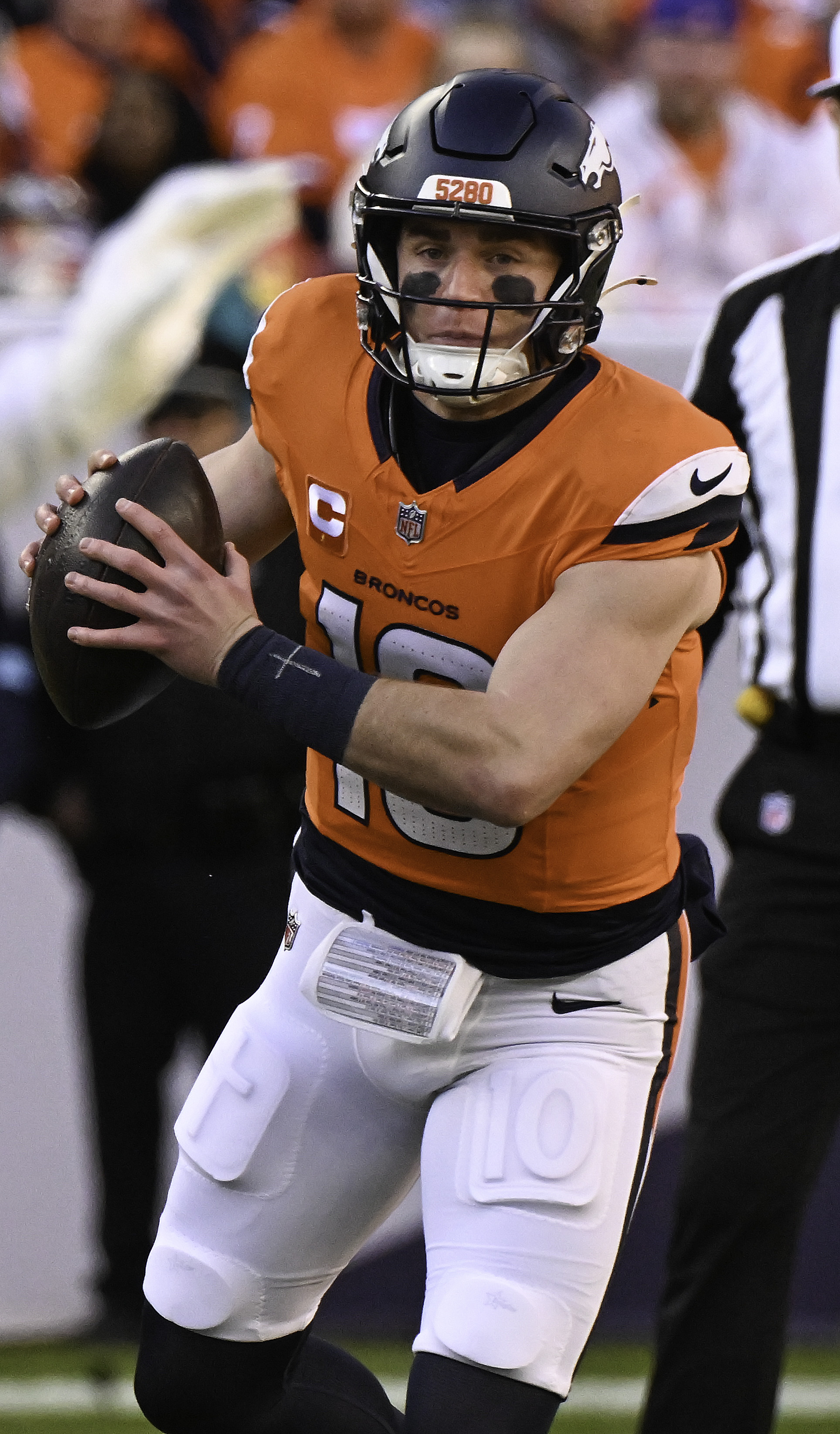 Denver Broncos quarterback Bo Nix (10) looks down field before throwing a pass during a game against the Colts. The Broncos defeated the Colts 31-13 at Empower Field at Mile High on Sunday, Dec. 15, 2024. (Jerilee Bennett,The Gazette)