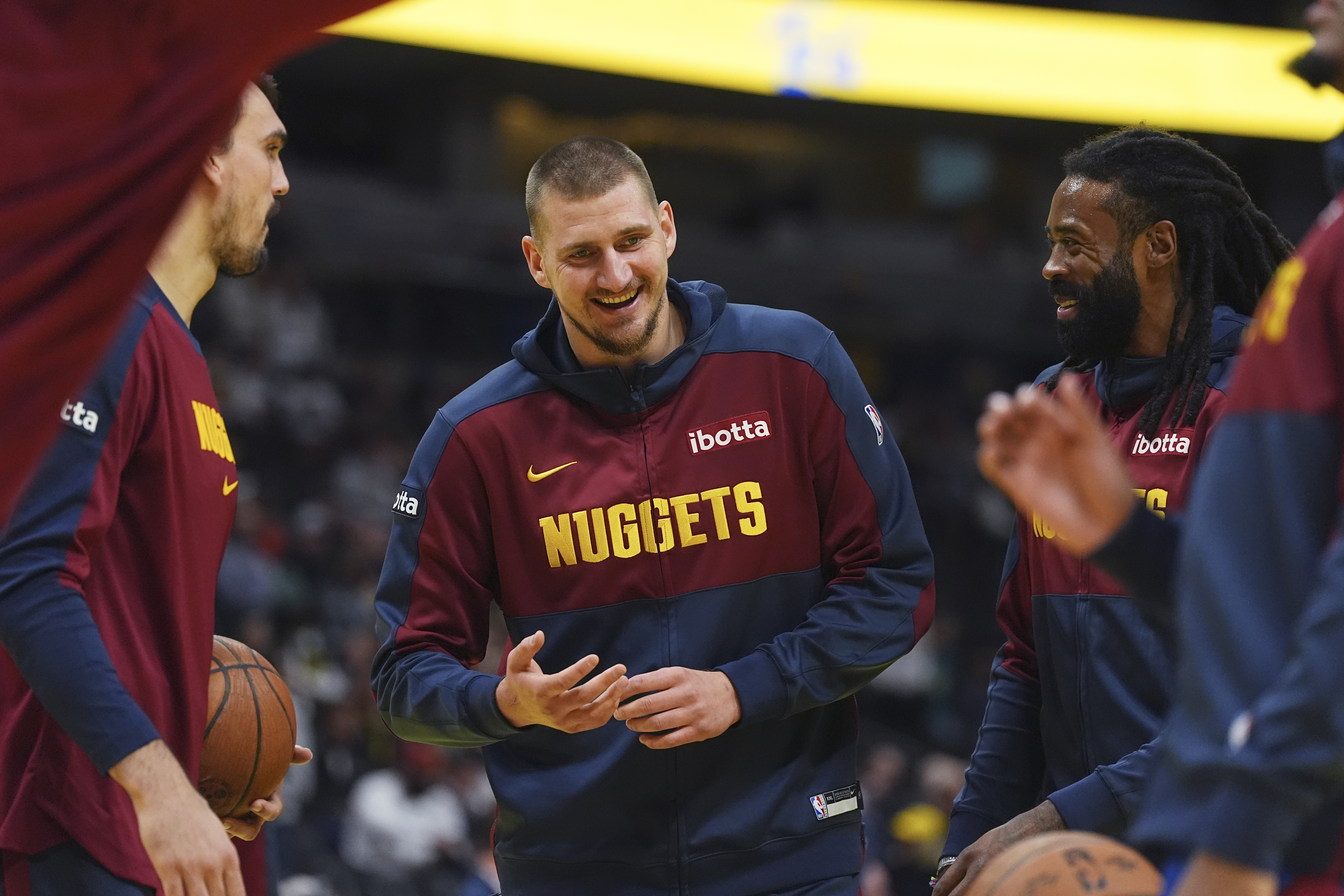 Denver Nuggets center Nikola Jokic (15) jokes with center DeAndre Jordan (6) in the first half of an Emirates NBA Cup basketball game Tuesday, Dec. 3, 2024, in Denver. (AP Photo/David Zalubowski) (David Zalubowski)