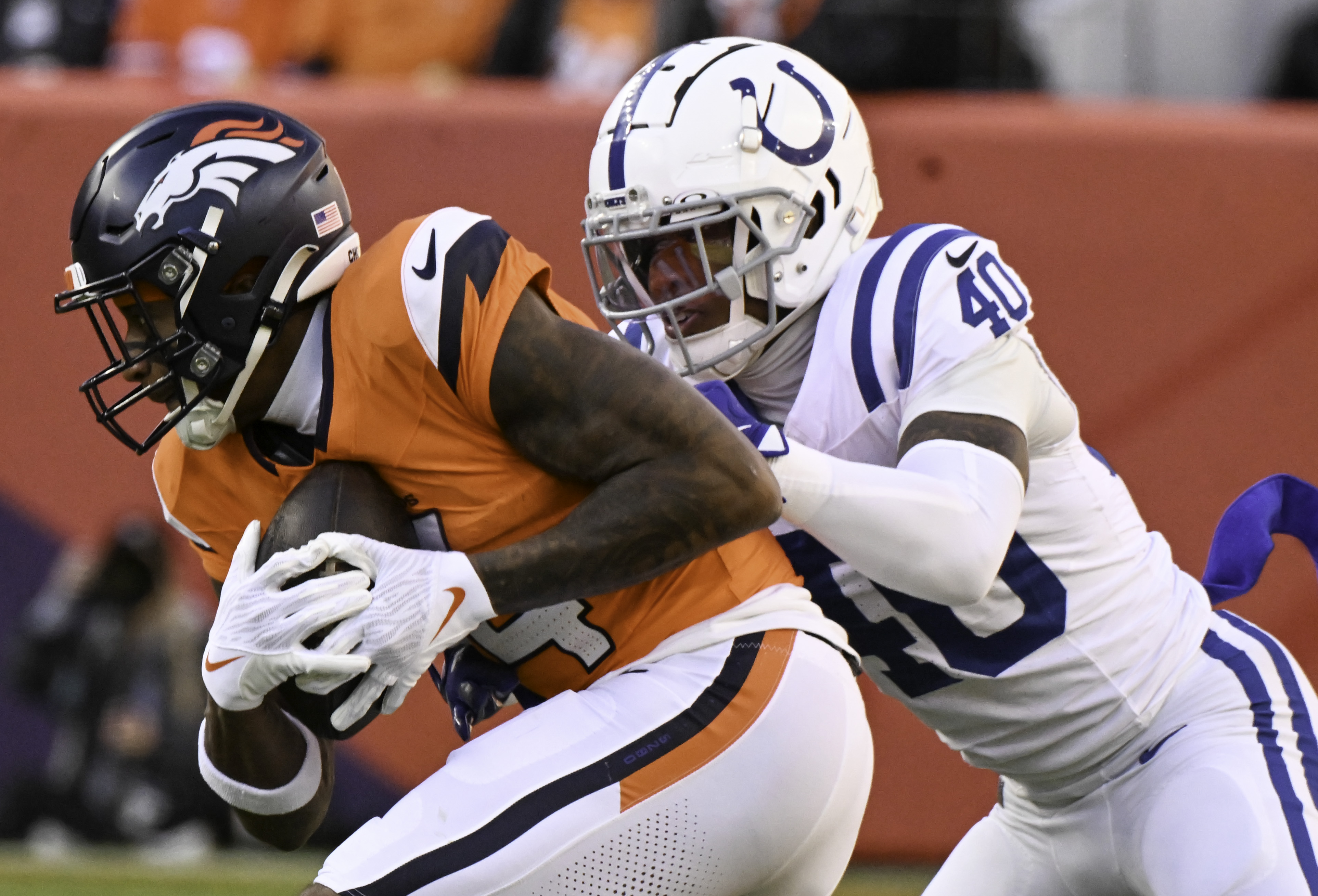 After a catch for a first down, Denver Broncos wide receiver Courtland Sutton (14) is defended by Indianapolis Colts cornerback Jaylon Jones (40) during a game. The Broncos defeated the Colts 31-13 at Empower Field at Mile High on Sunday, Dec. 15, 2024. (Jerilee Bennett,The Gazette)