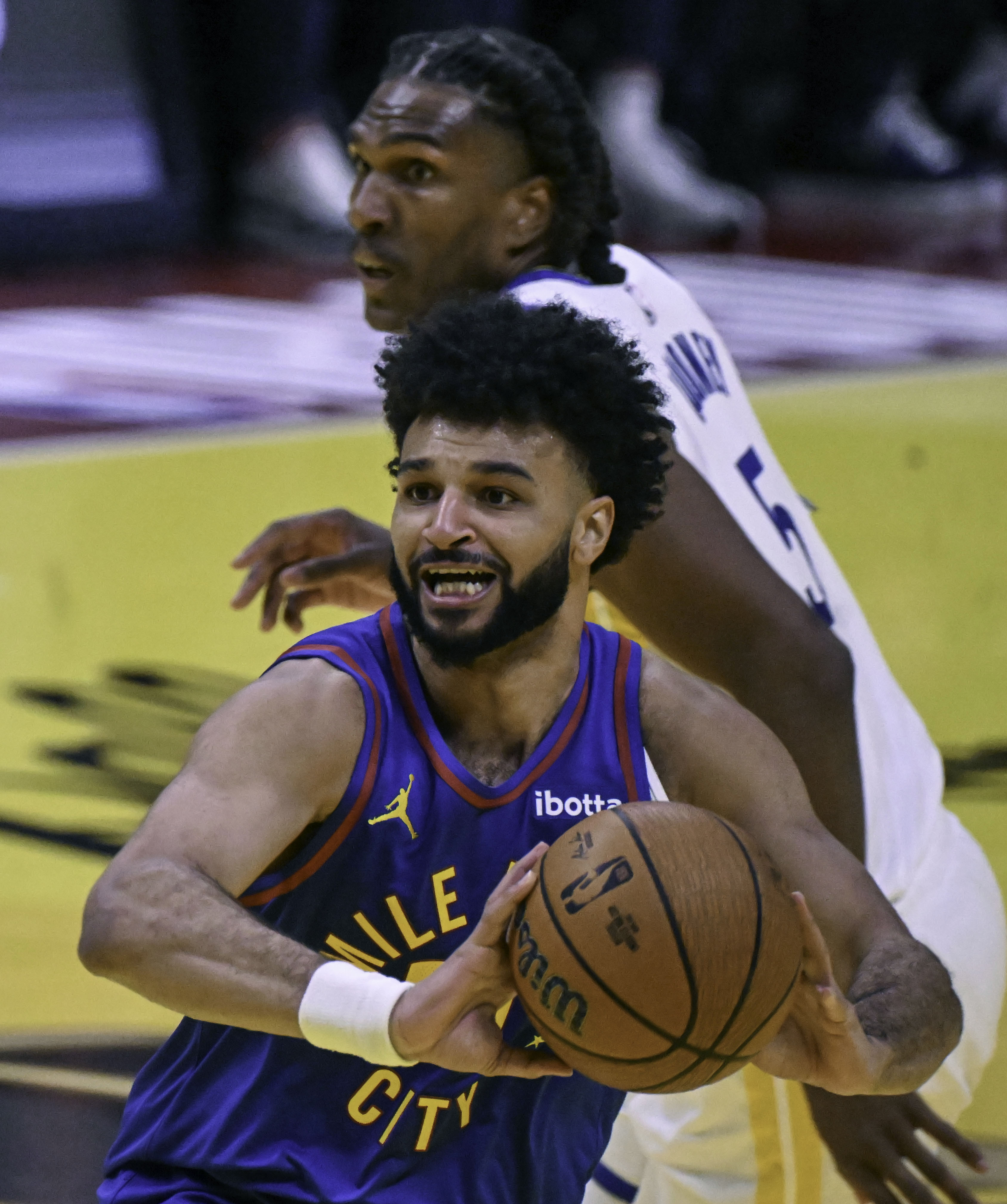 Denver Nuggets guard Jamal Murray (27) prepares to pass the ball during an Emirates NBA Cup Group Play game against the Warriors at Ball Arena on Tuesday, Dec. 3, 2024. The Nuggets defeated the Warriors 119-115. (Jerilee Bennett,The Gazette)