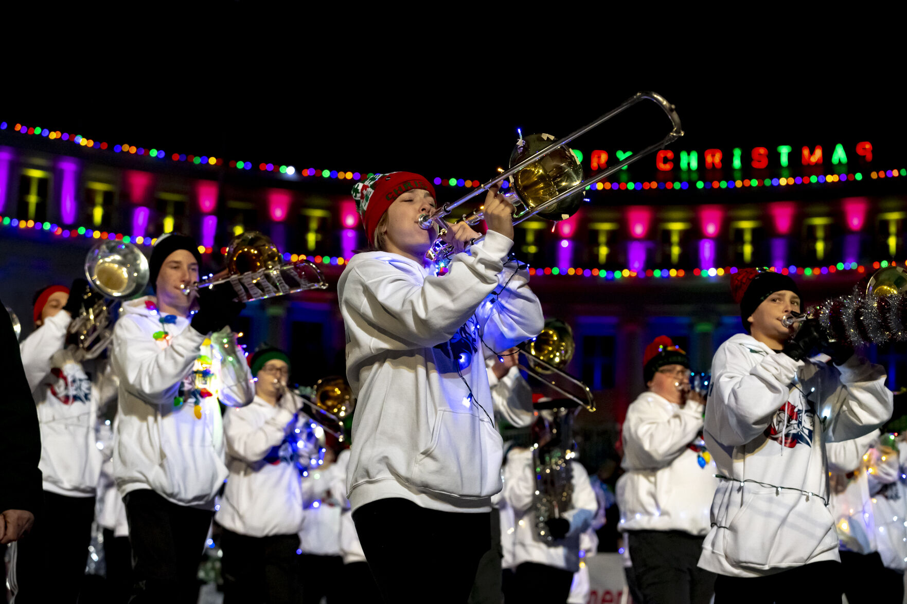 A member of the Columbine High School marching band plays the trumpet in front of the Denver City Council building on Bannock Street in Denver on Saturday, Dec. 7, 2024 during the 9NEWS 50th Anniversary Parade of Lights. (Laura Domingue/Special to the Gazette) (LAURA DOMINGUE/Special to The Denver Gazette)